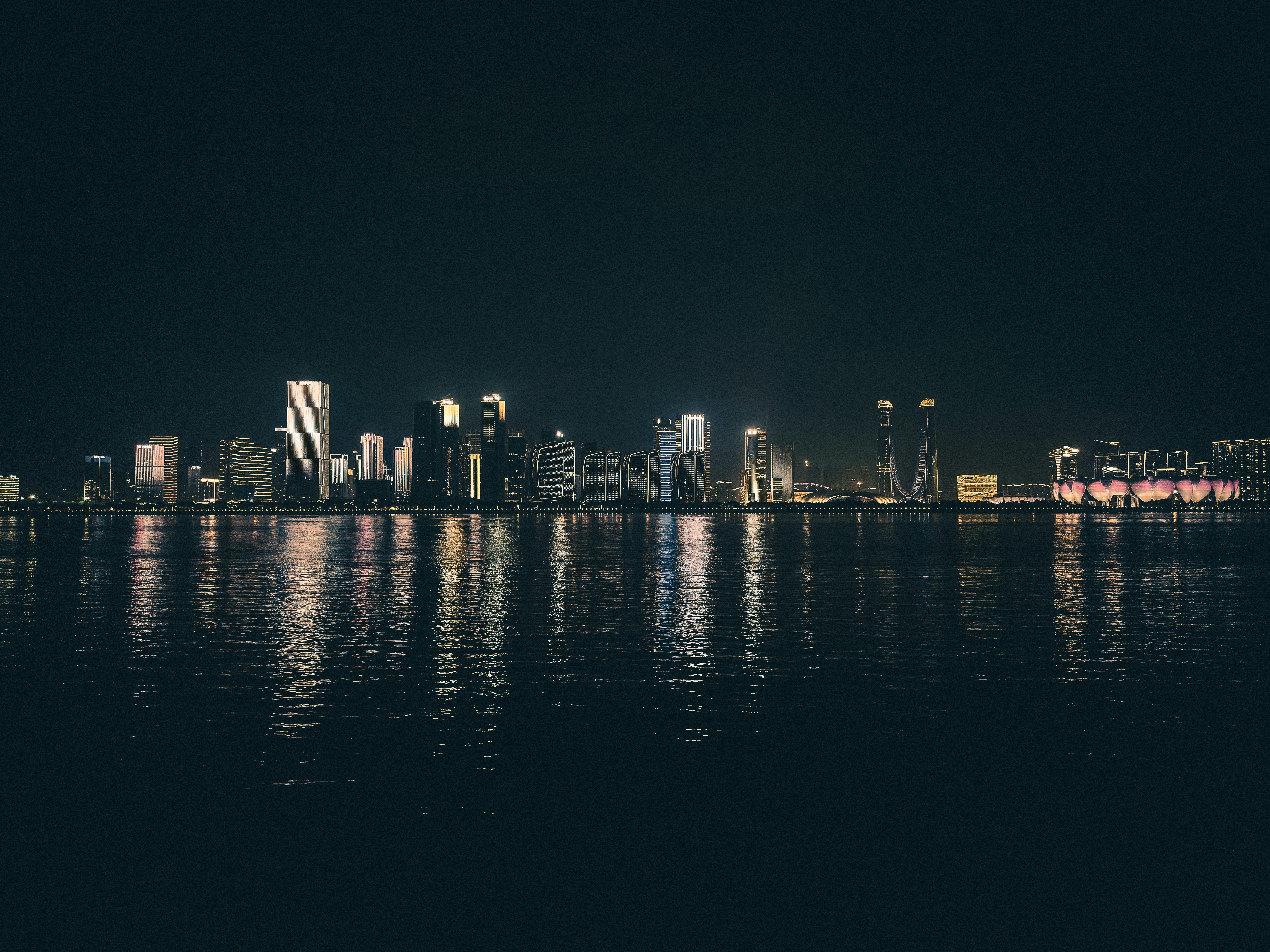 A view of a city at night from across the water
