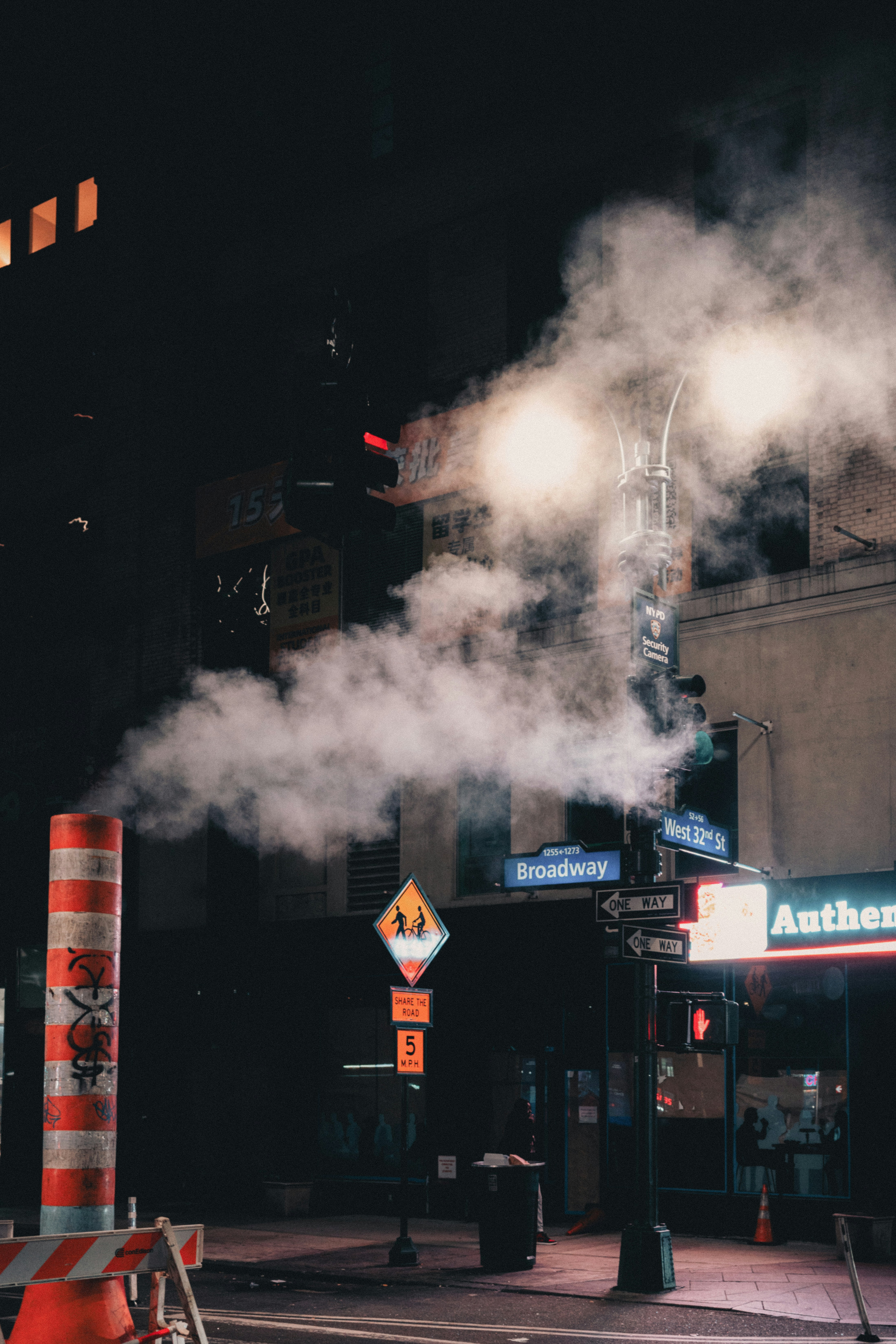 A city street with a lot of smoke coming out of it