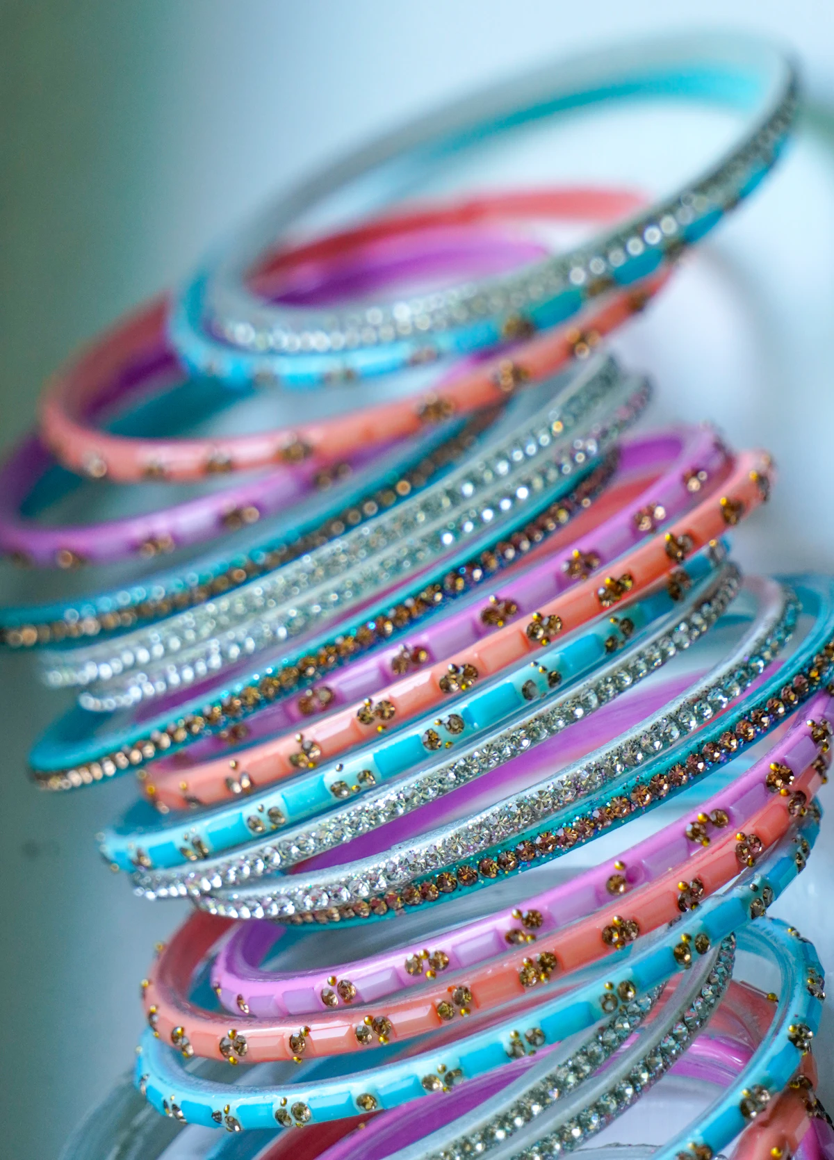 A bunch of gold bangles laid out on a table