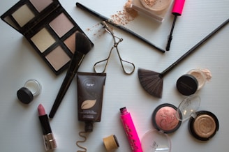 A variety of cosmetics and makeup products on a table