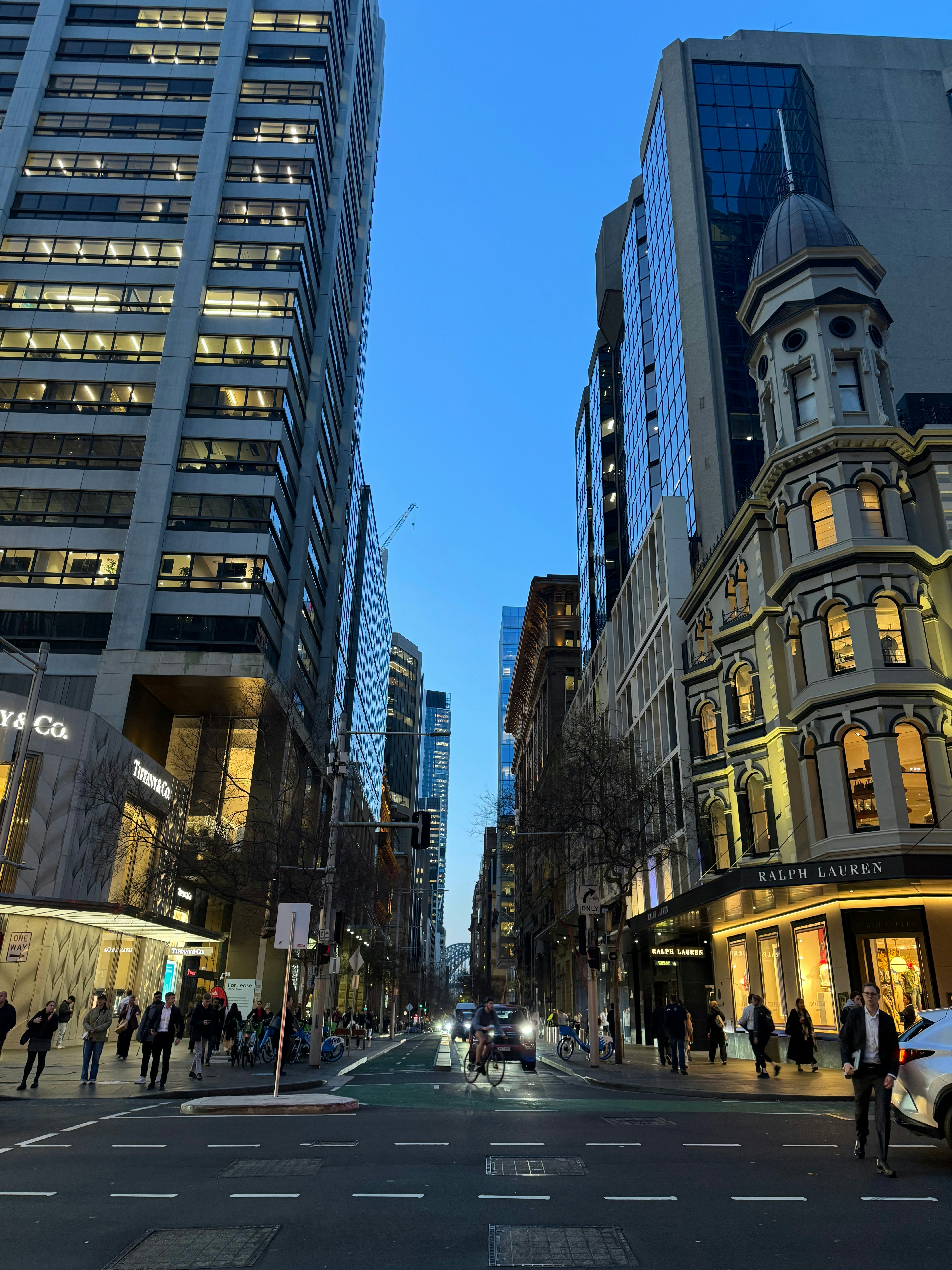 A city street filled with lots of tall buildings