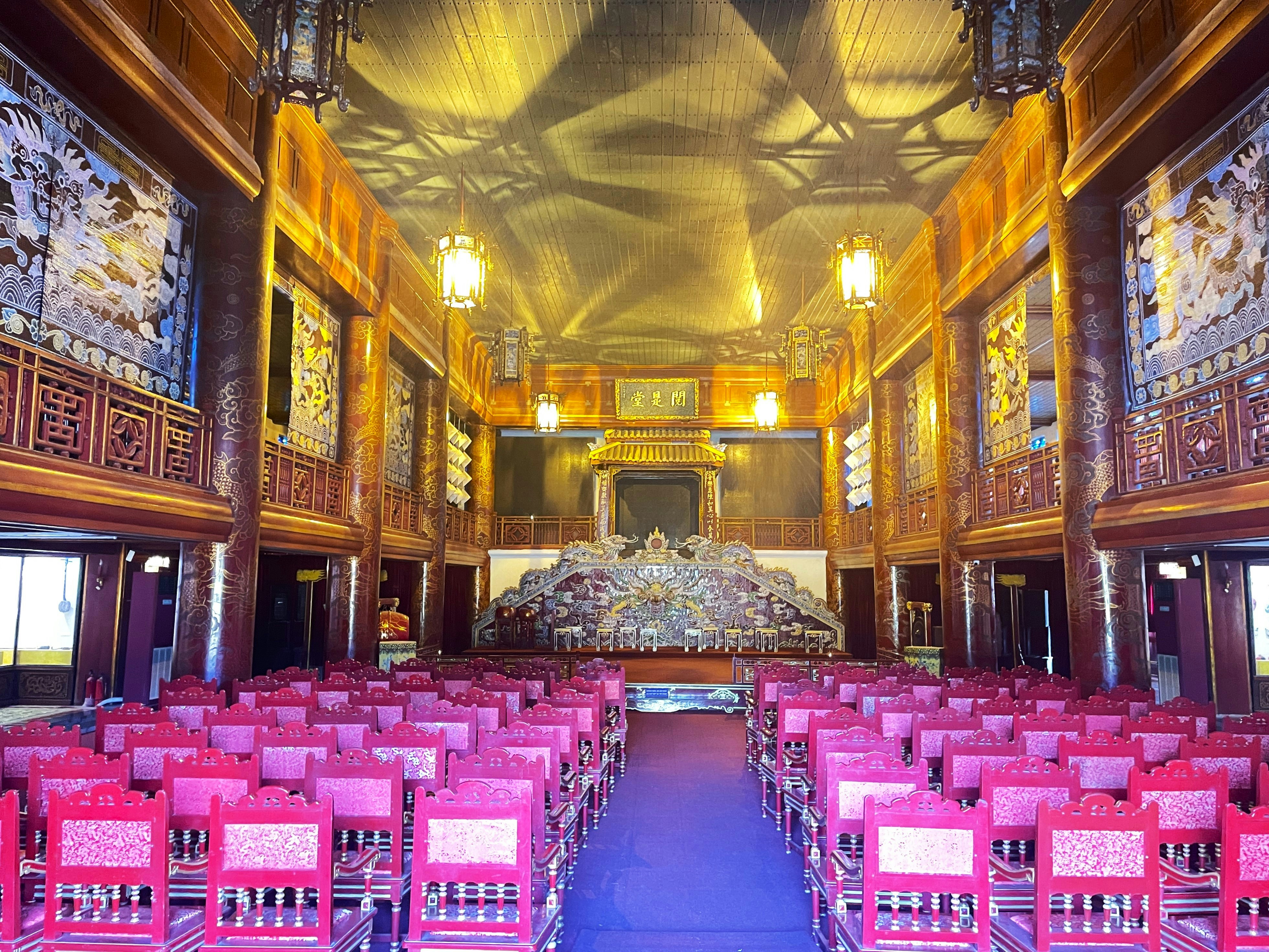 A large auditorium filled with lots of pink chairs, Duyet Thi Duong Royal Theater - Imperial City, Hue, Vietnam