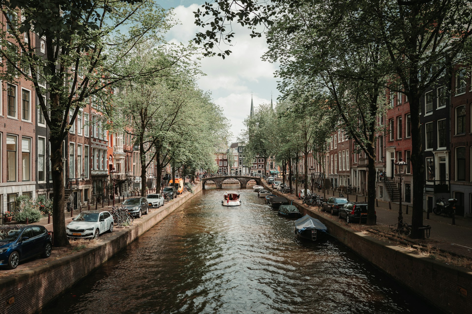 A river running through a city next to tall buildings