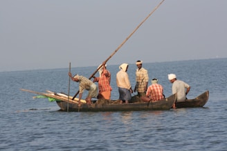 A group of people riding on the back of a boat