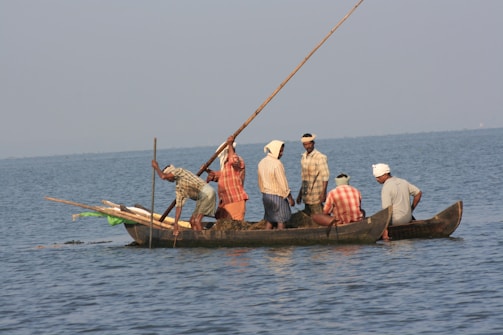 A group of people riding on the back of a boat