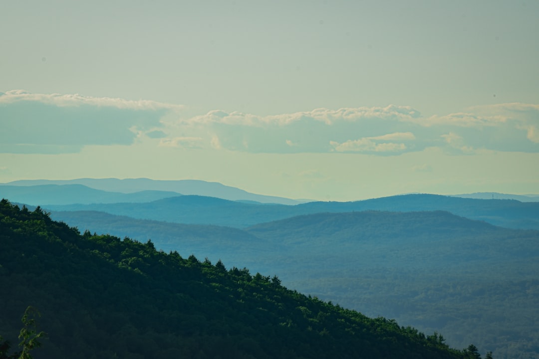 A view of the mountains from the top of a hill