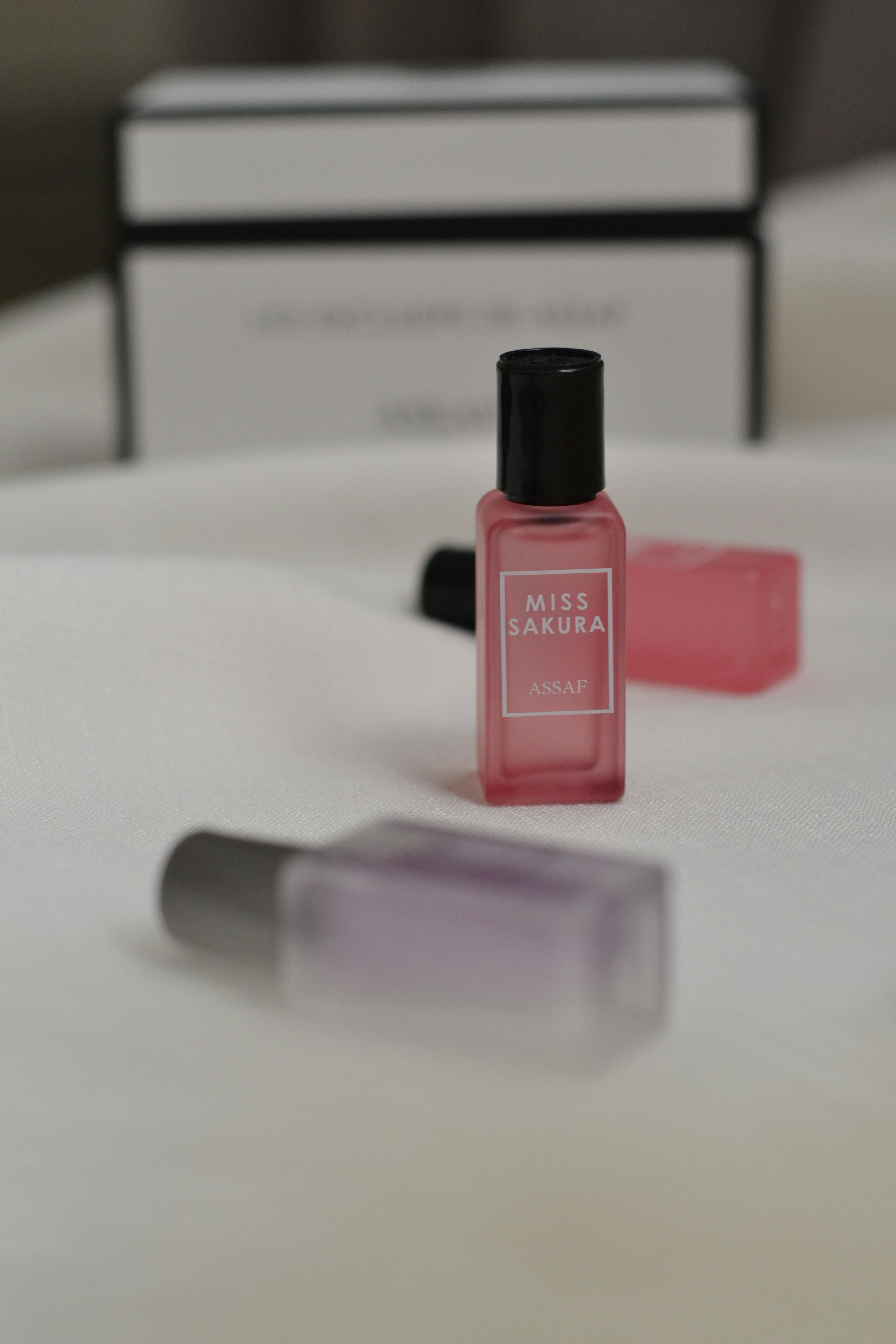 A bottle of perfume sitting on top of a table