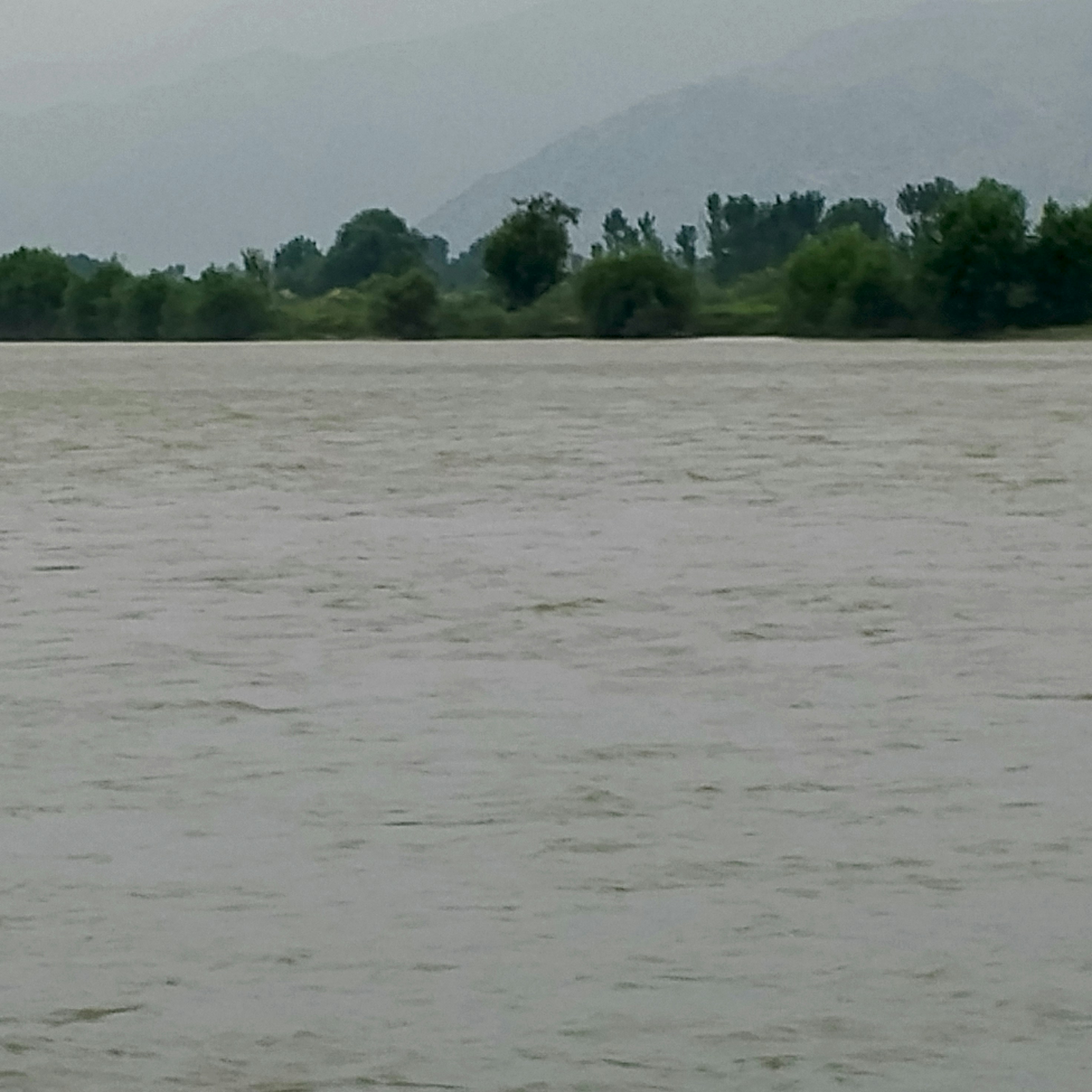 A man riding a surfboard on top of a body of water