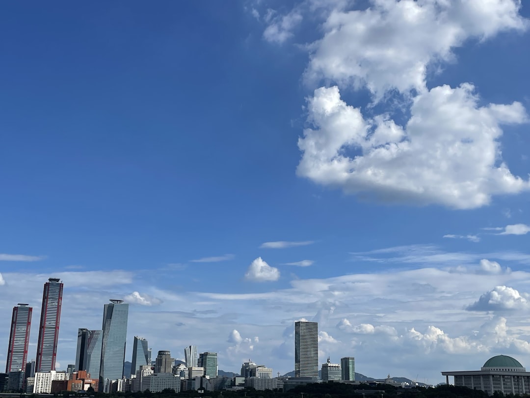 A large body of water with a city in the background,