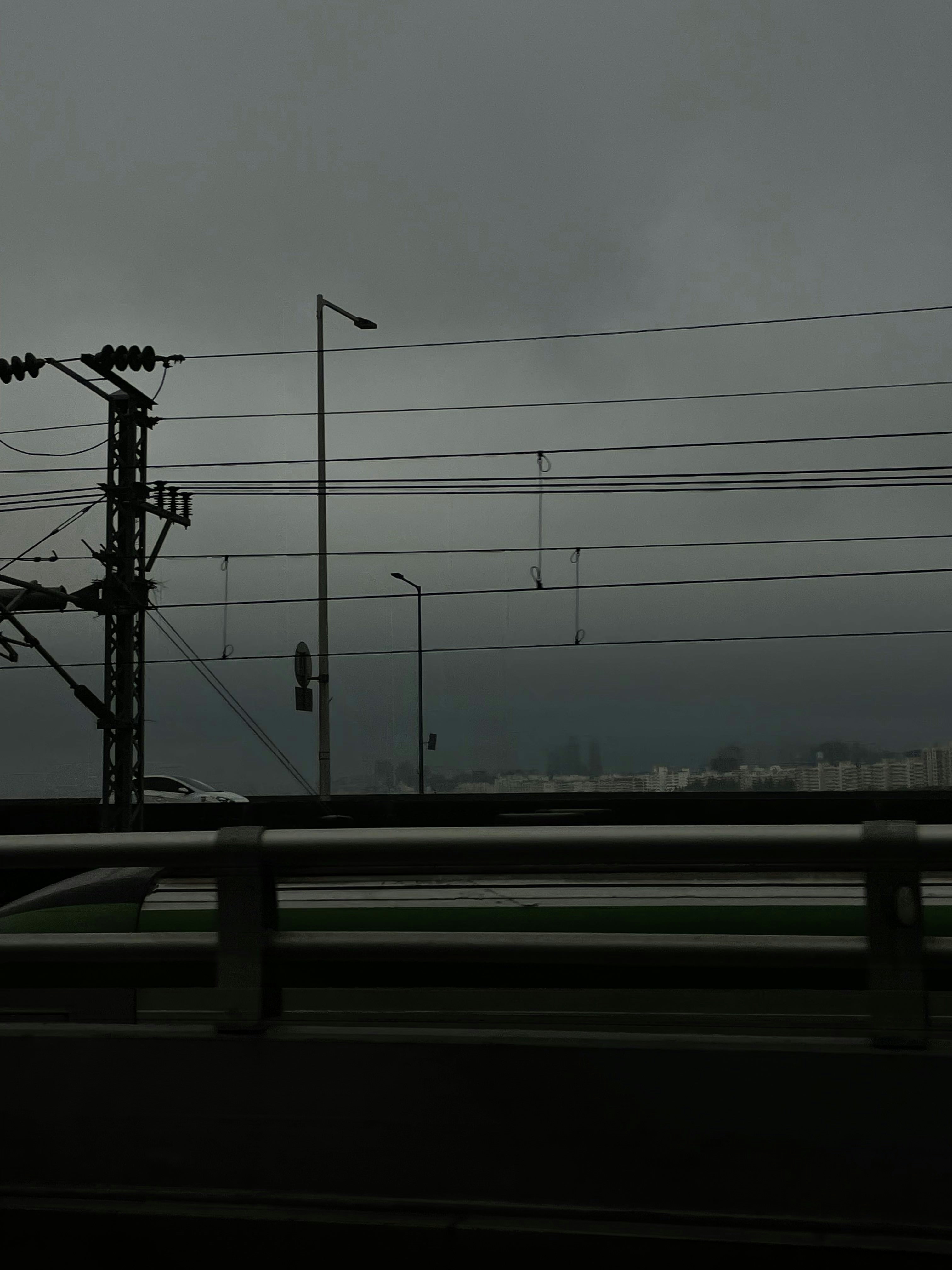 A view of power lines in the distance from a highway