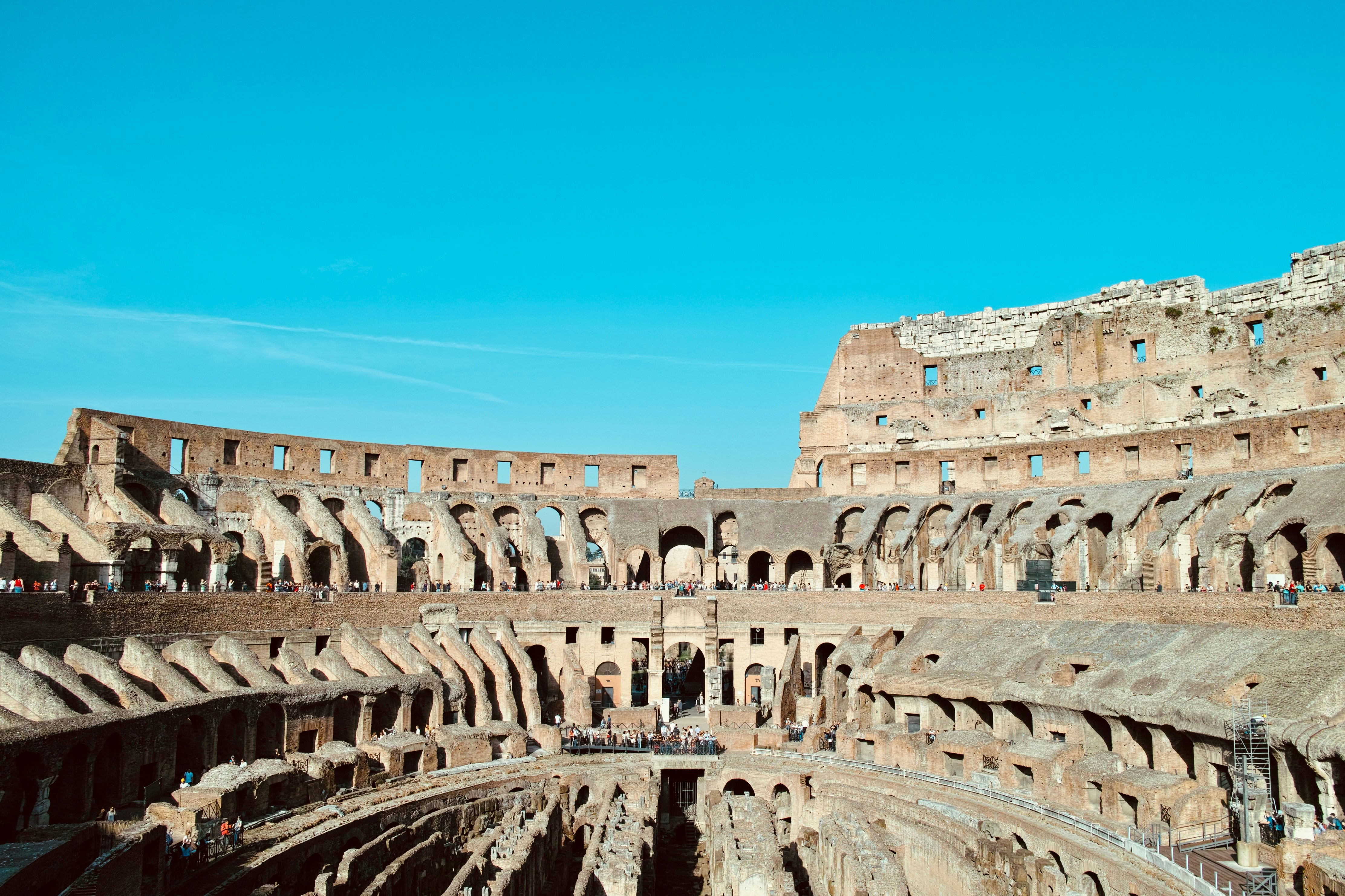 The interior of a large building with a sky background