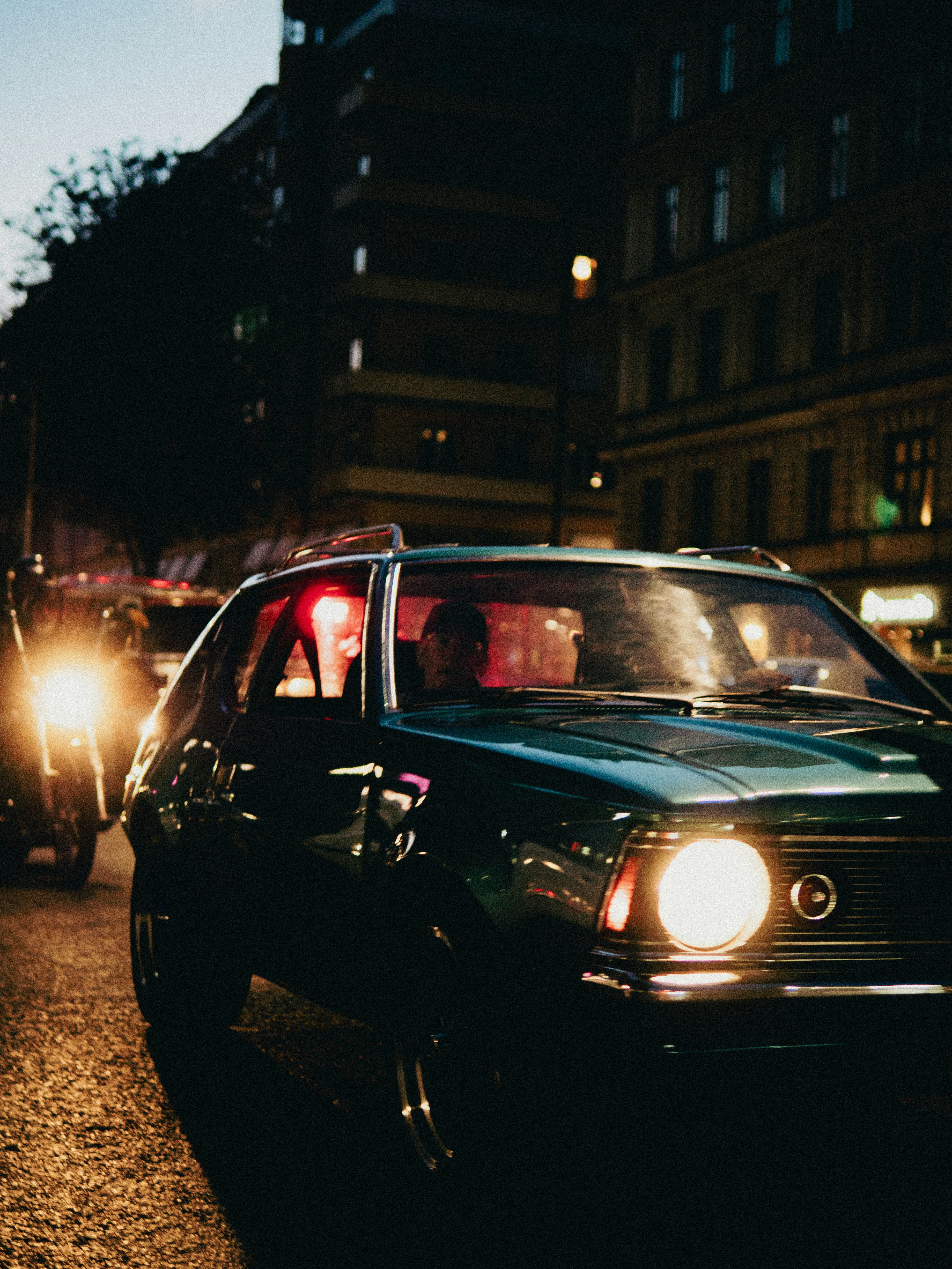 A couple of cars that are sitting in the street
