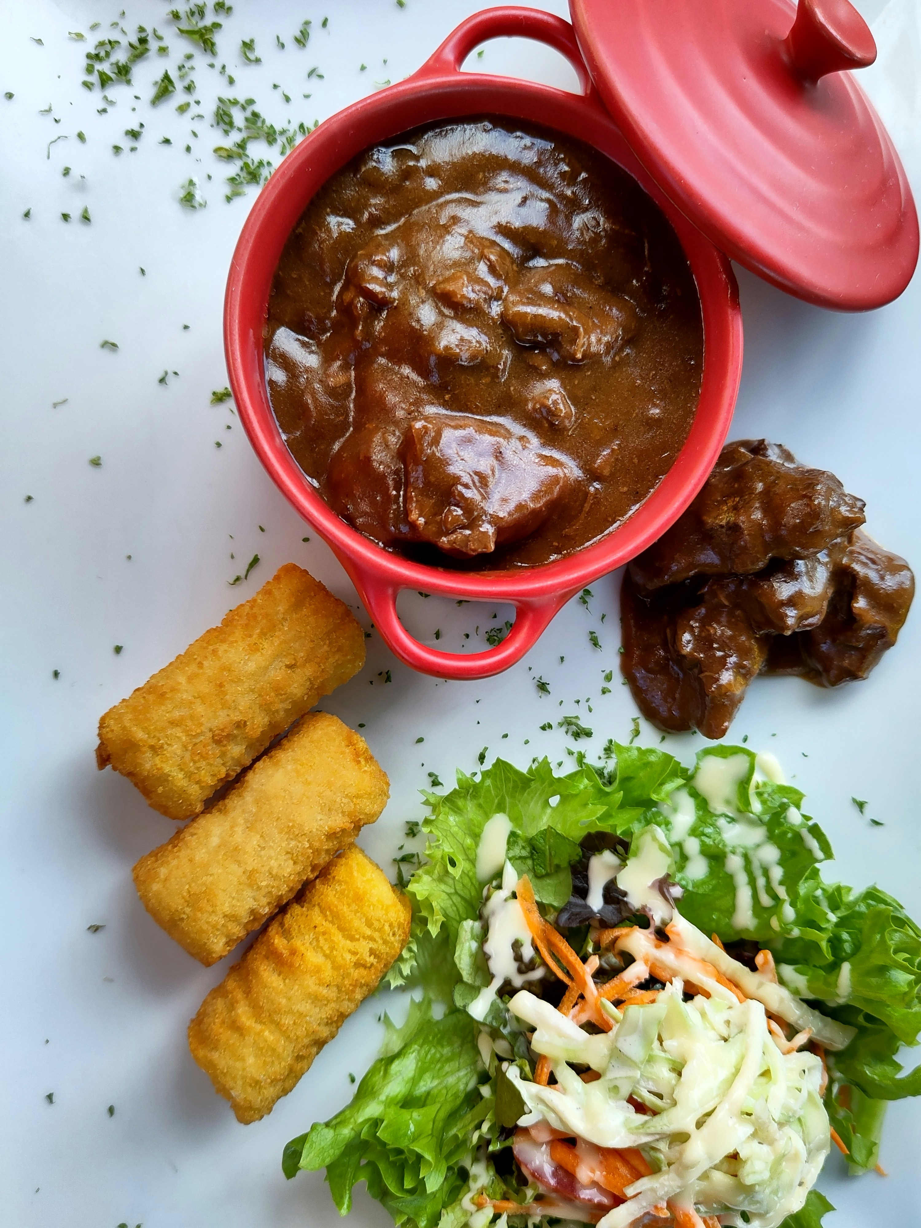 Stew served with salad