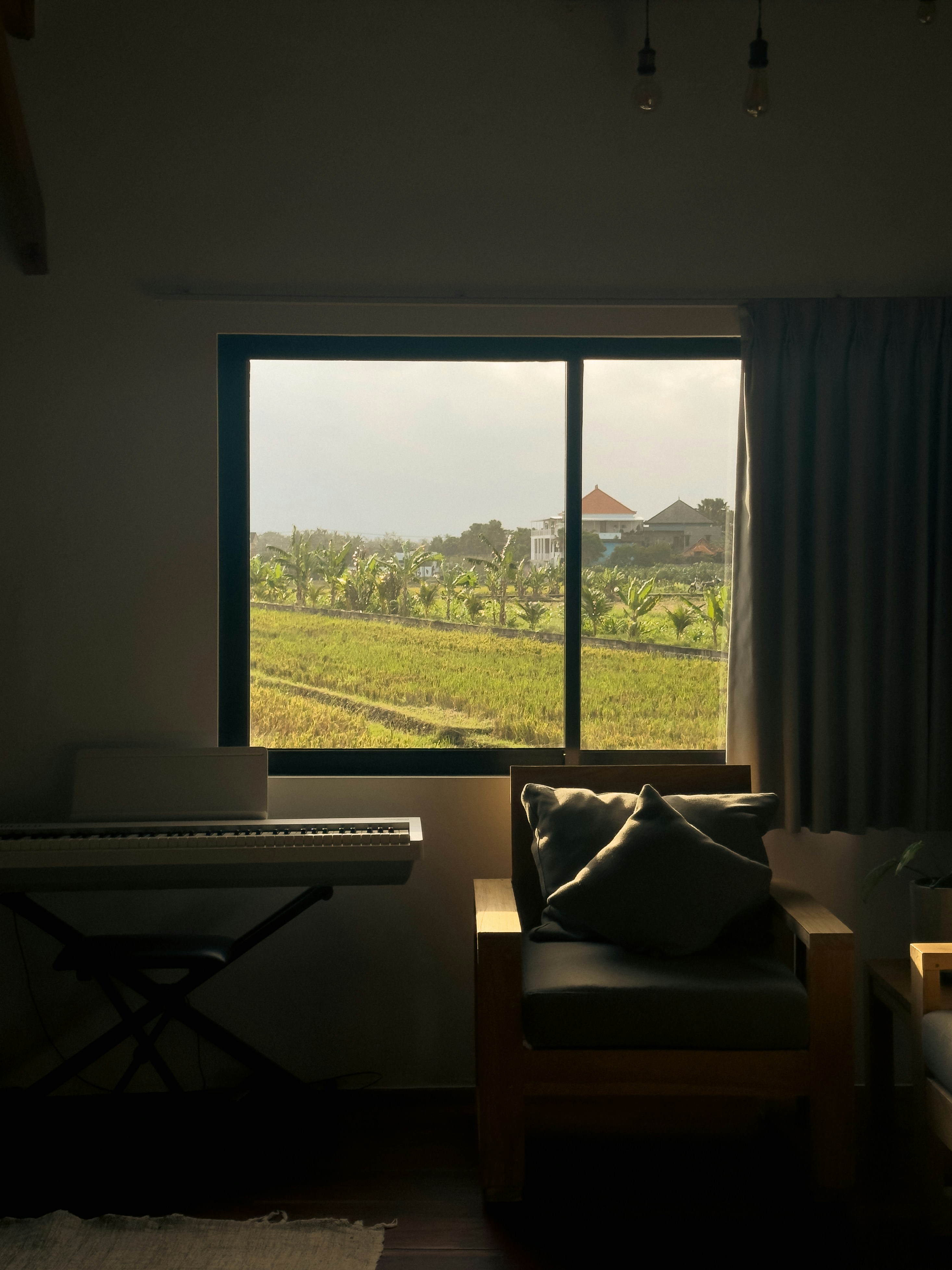 A living room with a couch and a large window