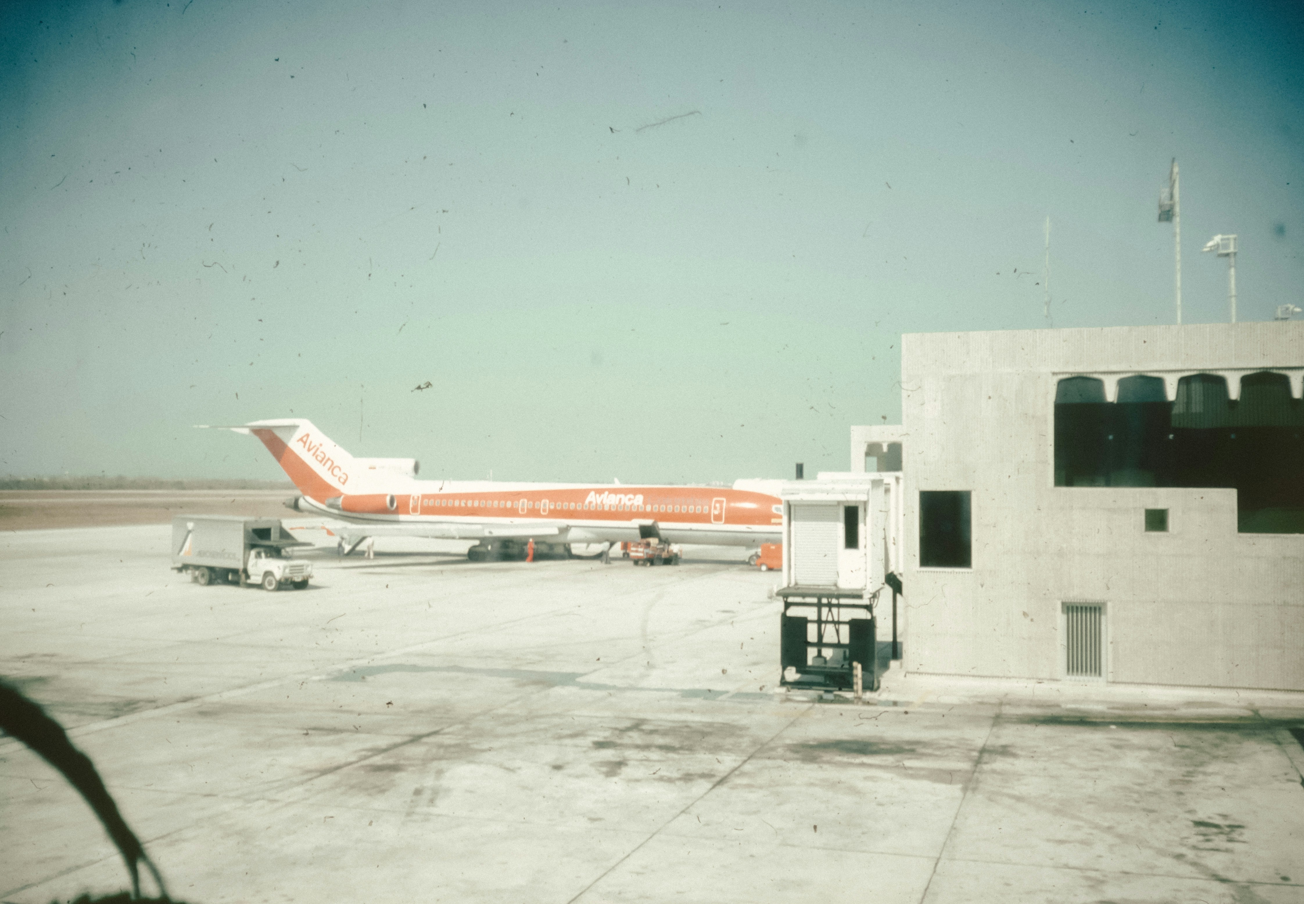 A large jetliner sitting on top of an airport tarmac