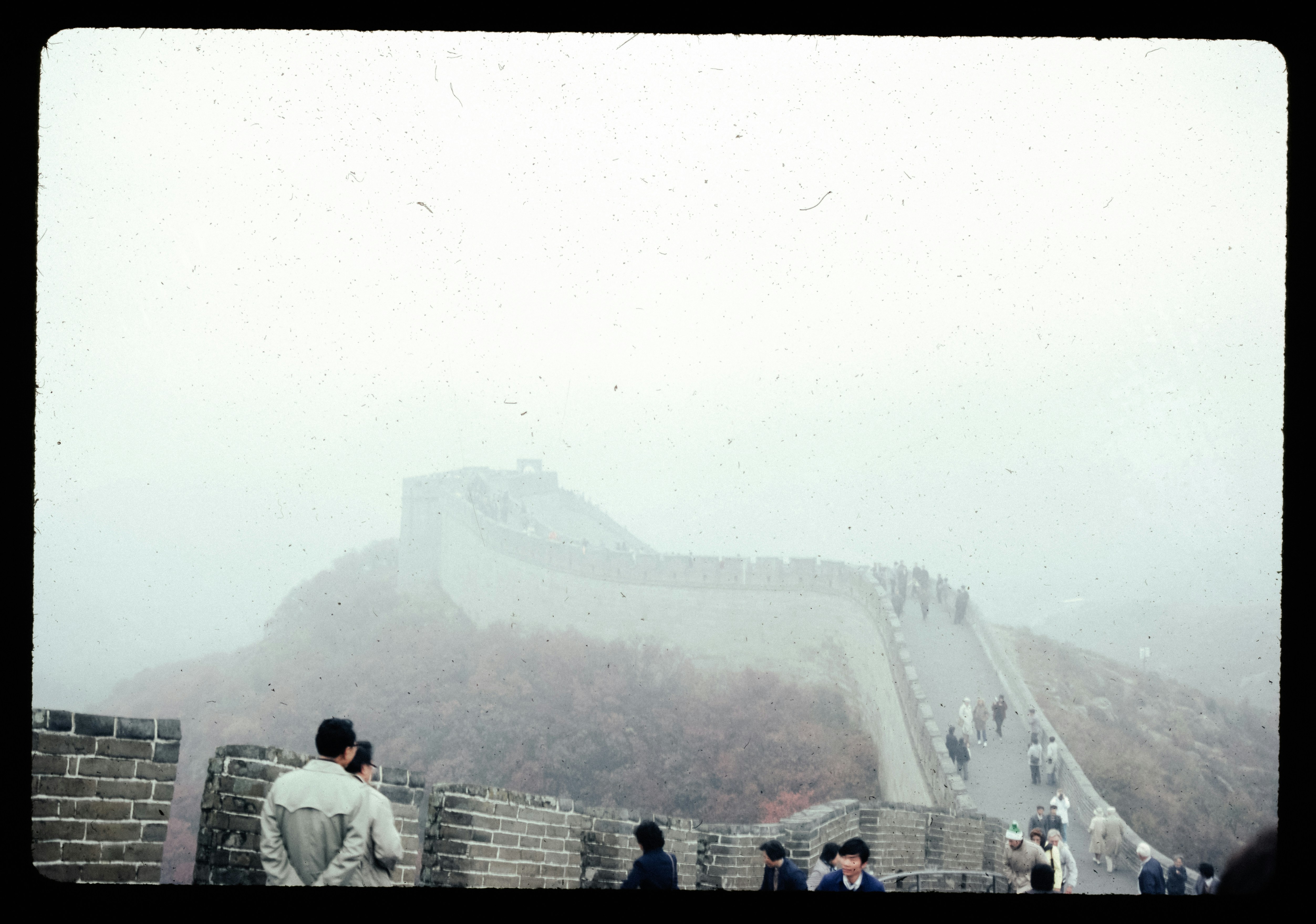 A group of people standing on the great wall of china