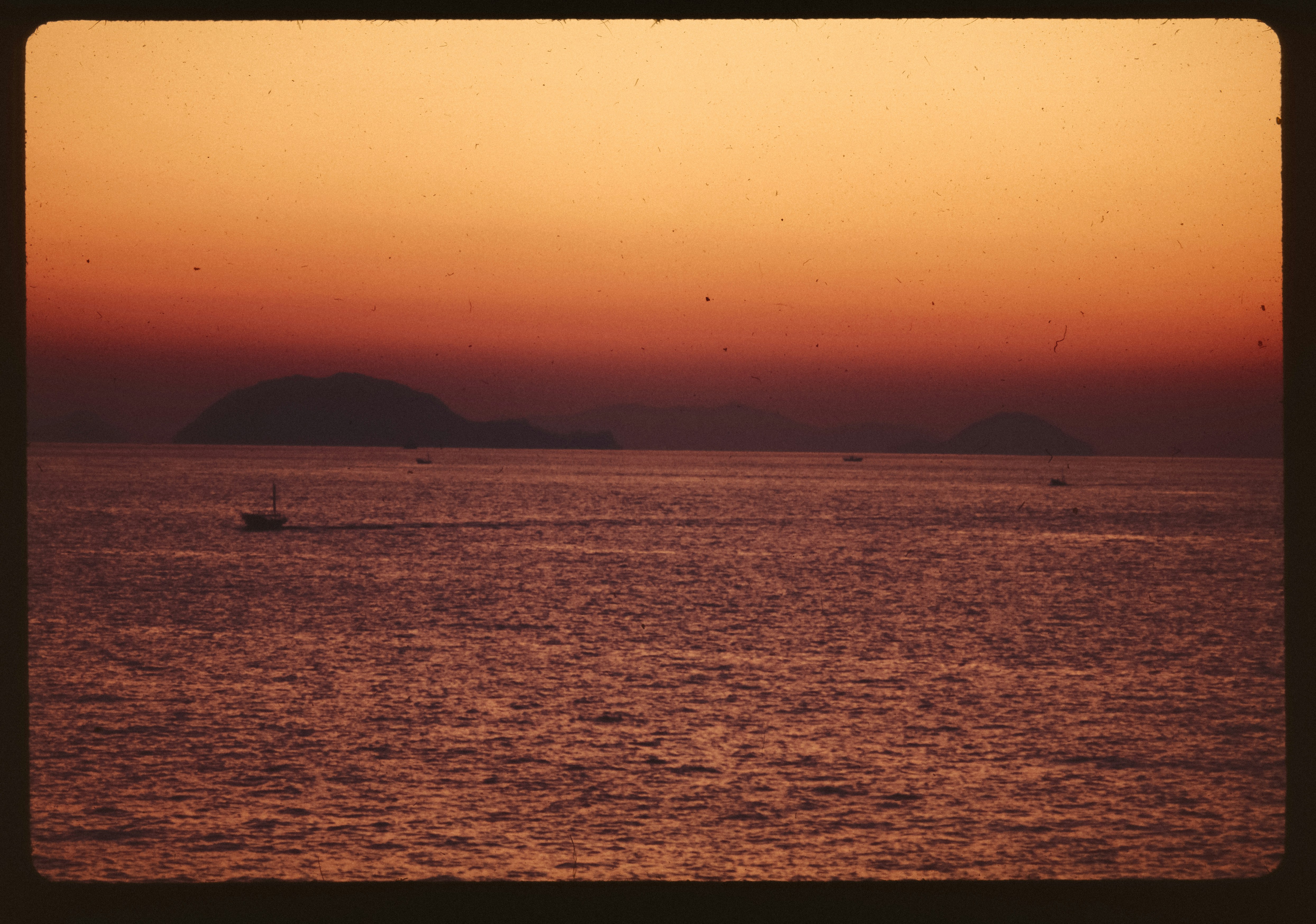 A picture of a sunset over a body of water