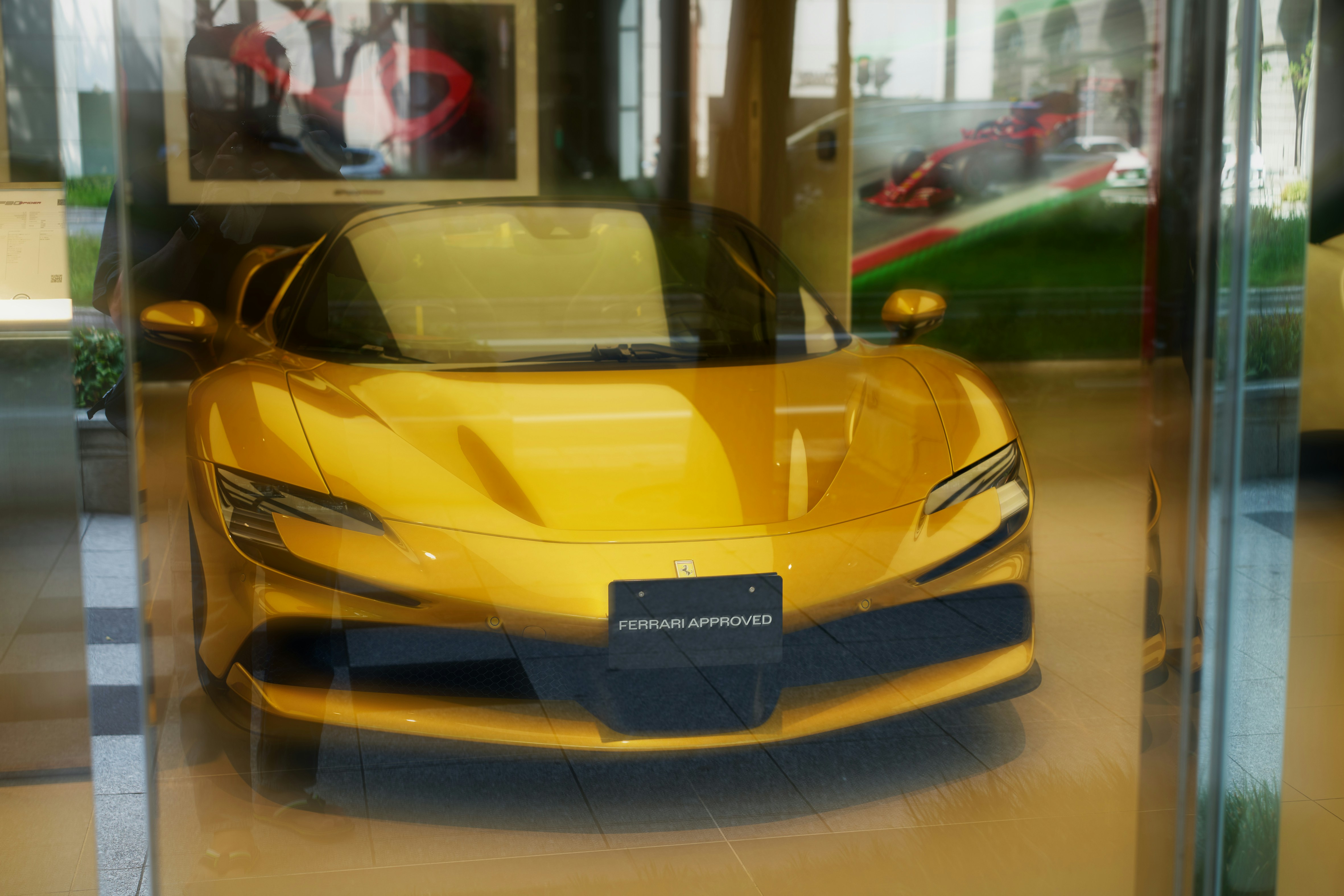 A yellow sports car sitting in a showroom