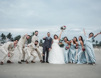 A group of people standing next to each other on a beach