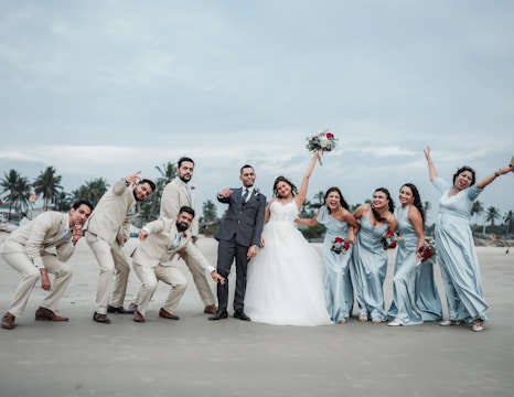 A group of people standing next to each other on a beach