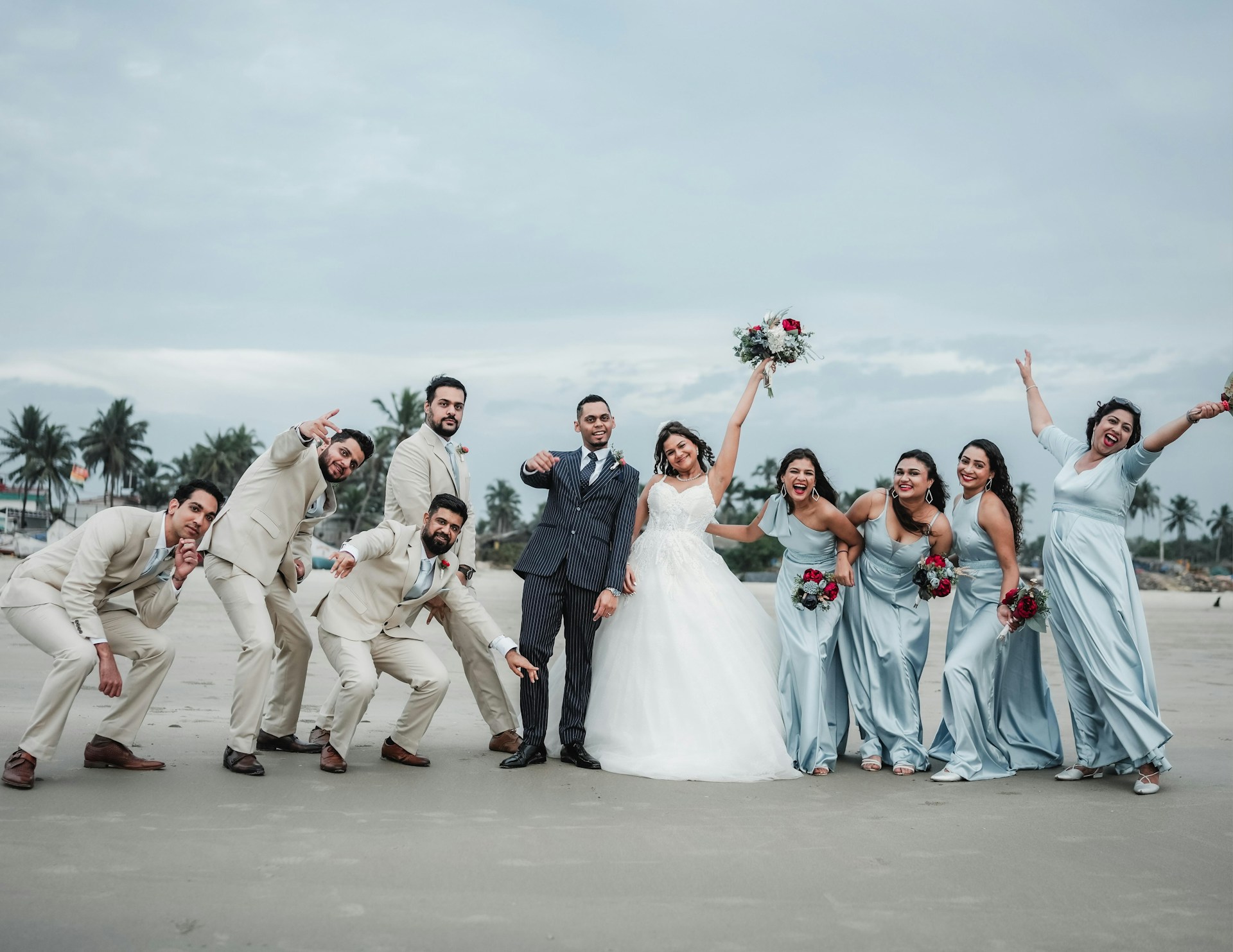 A group of people standing next to each other on a beach