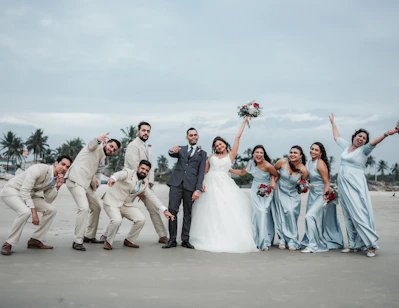 A group of people standing next to each other on a beach