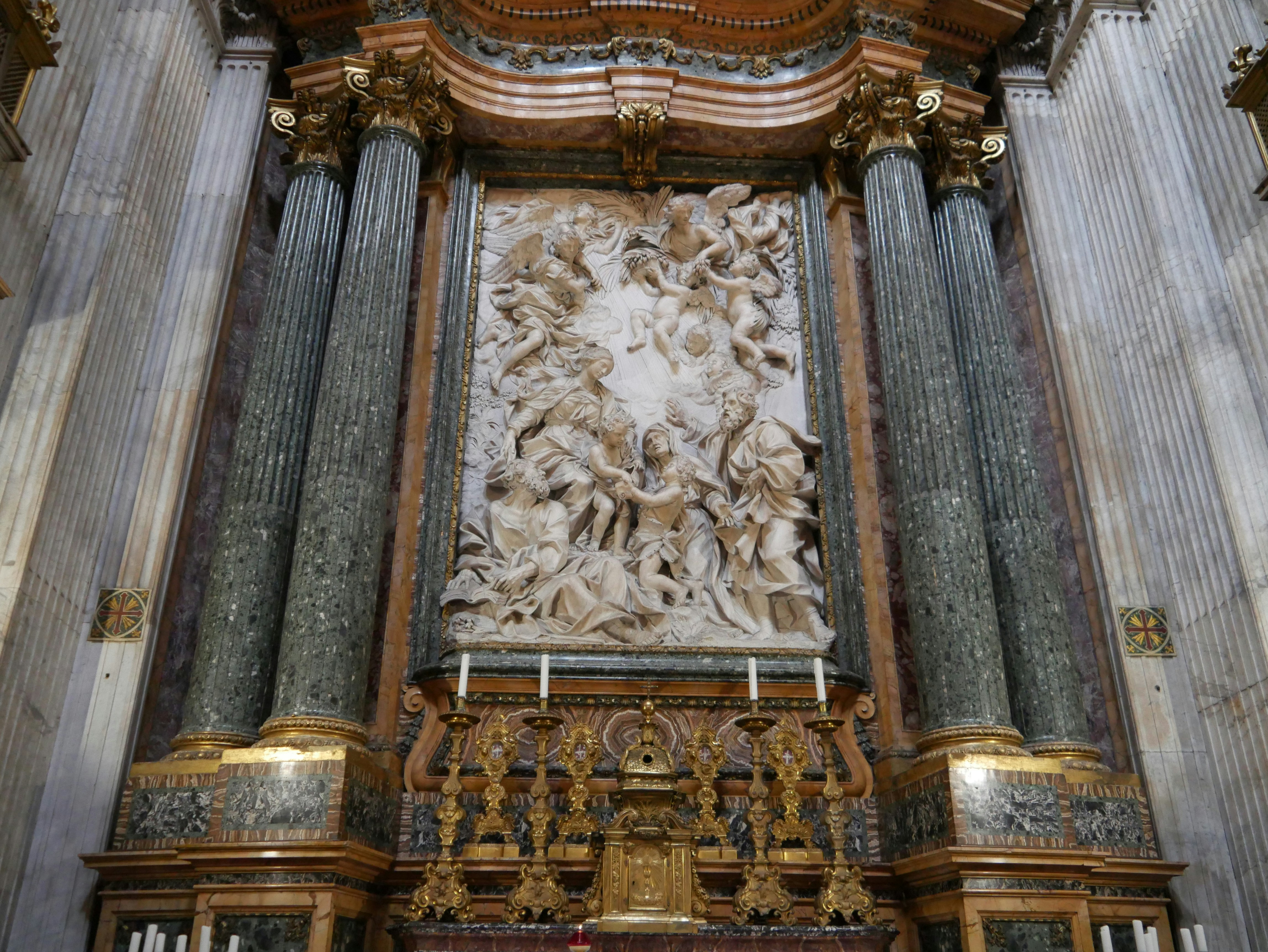 A large ornate wooden alter in a church