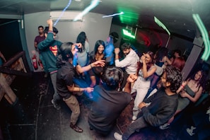 A group of people dancing in a room