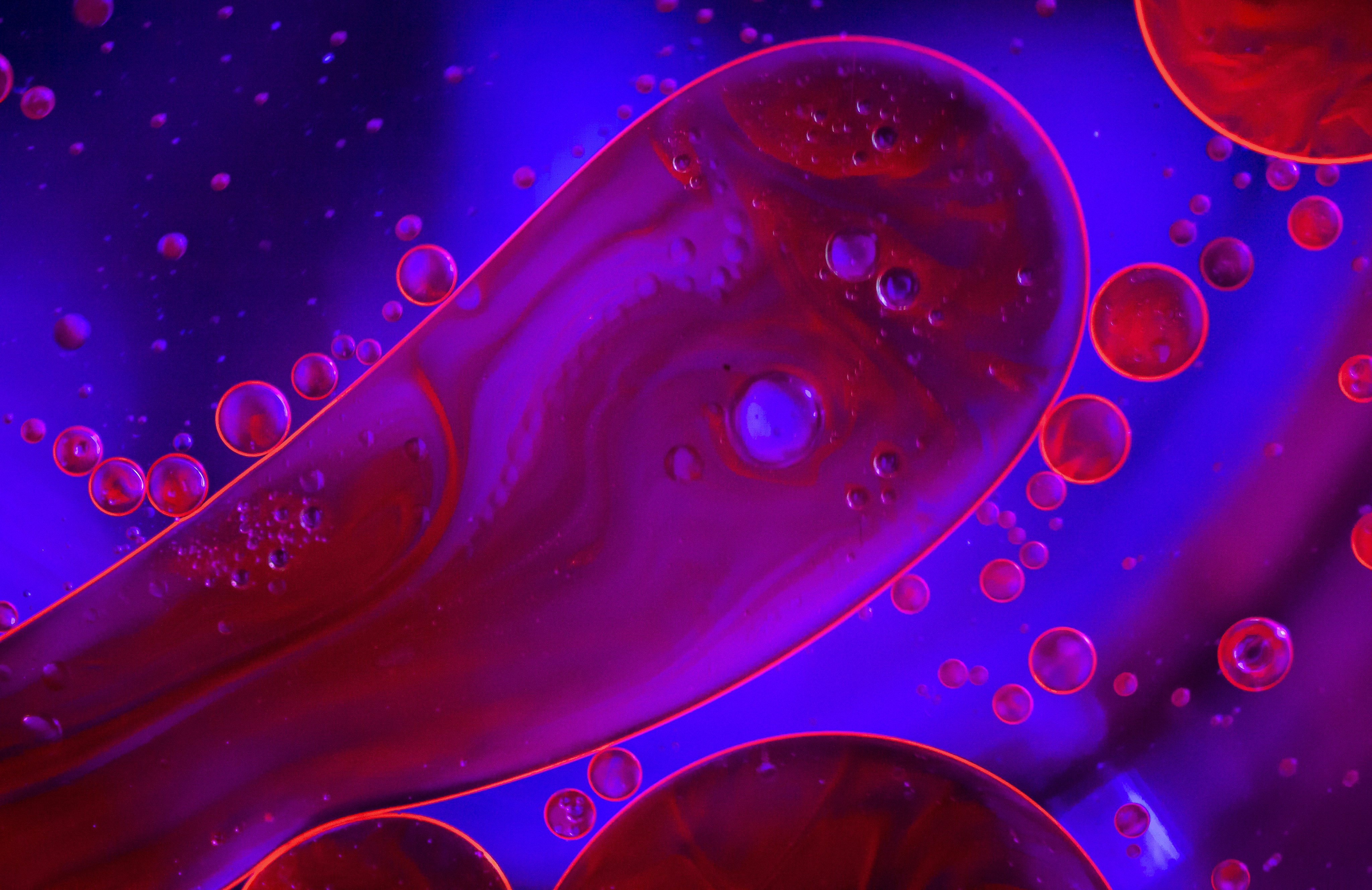 A close up of a red and purple liquid