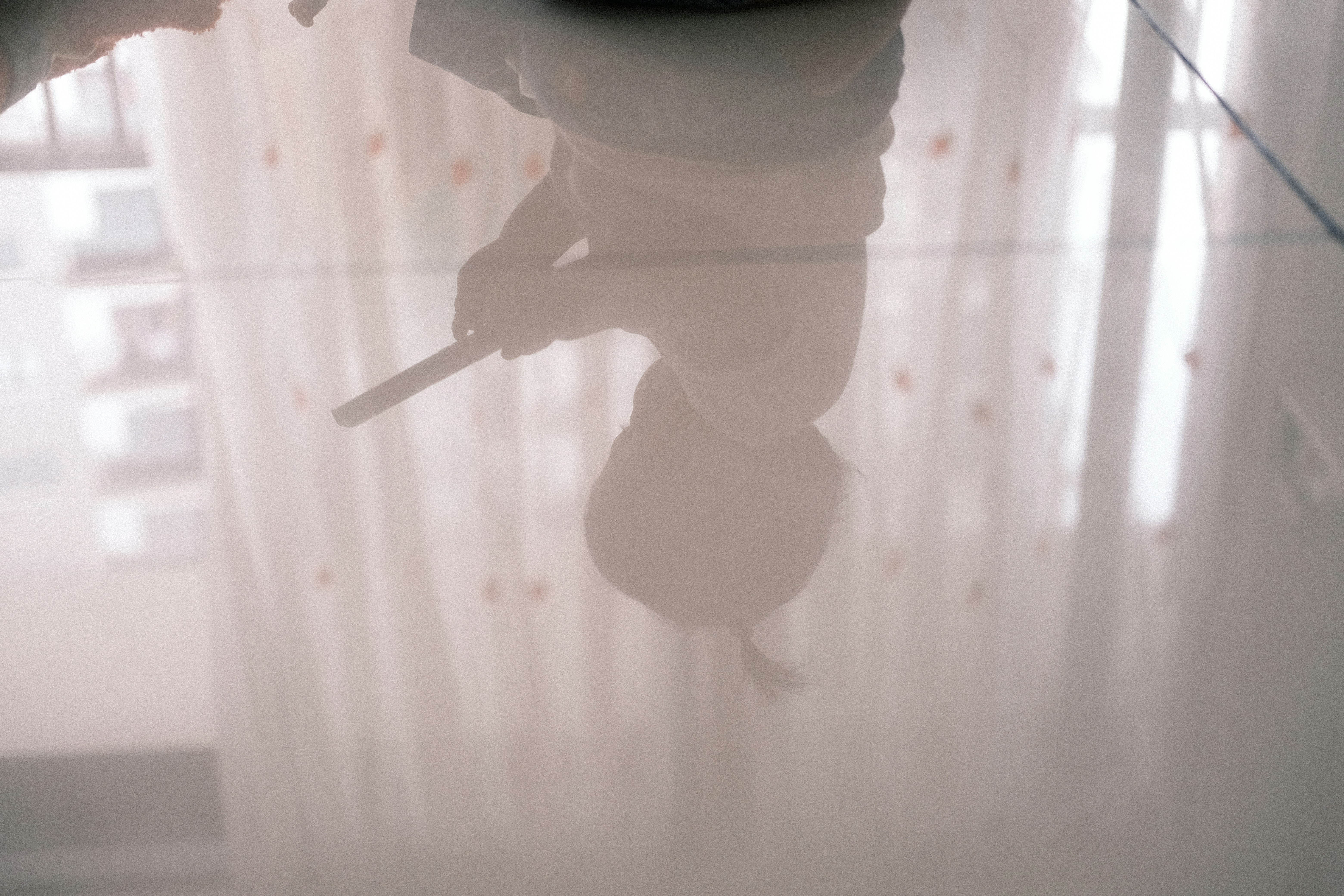 Person using a wet-dry vacuum on a wet carpet