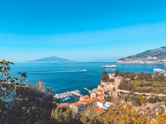 A scenic view of the ocean and mountains