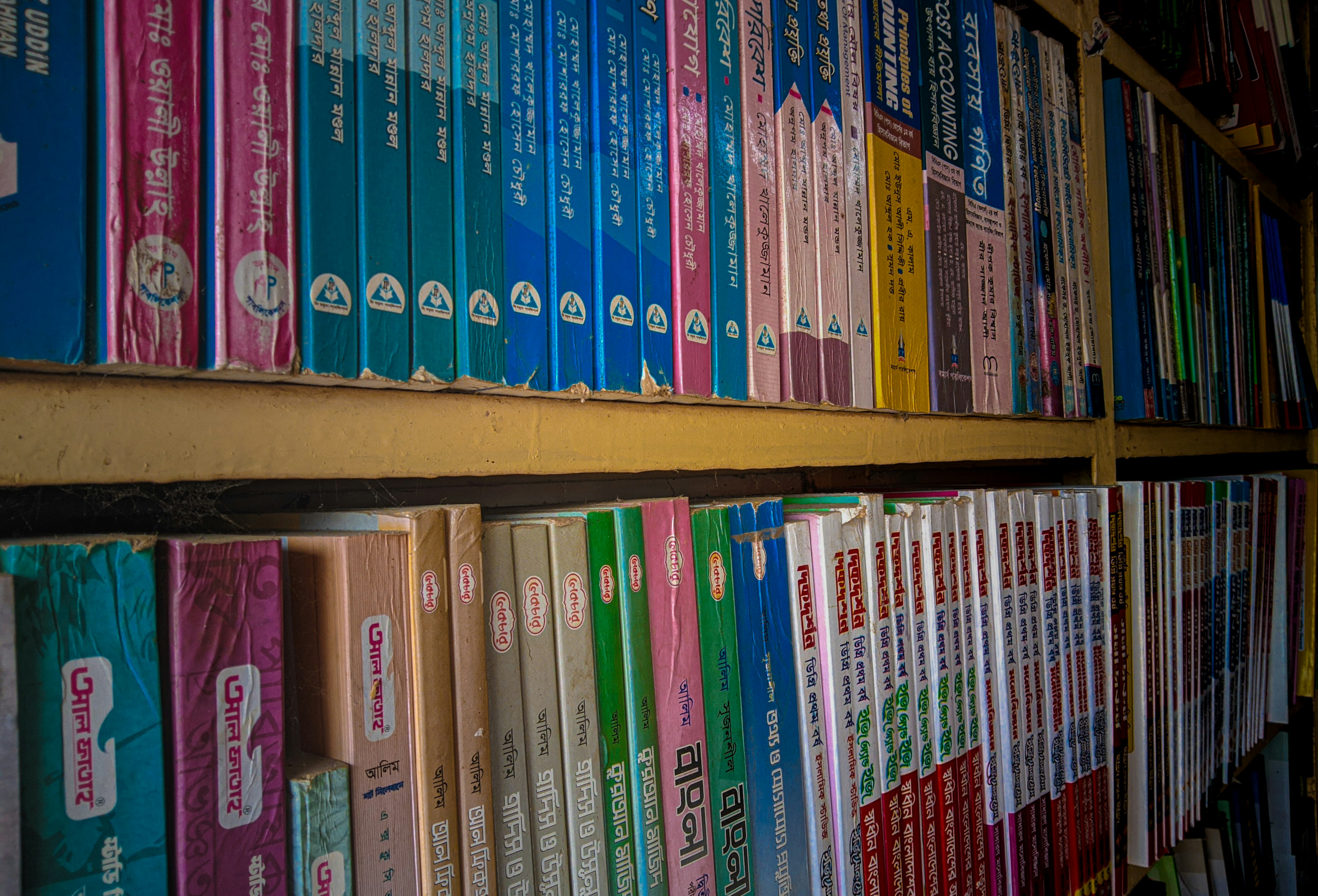 A row of books on a shelf in a library
