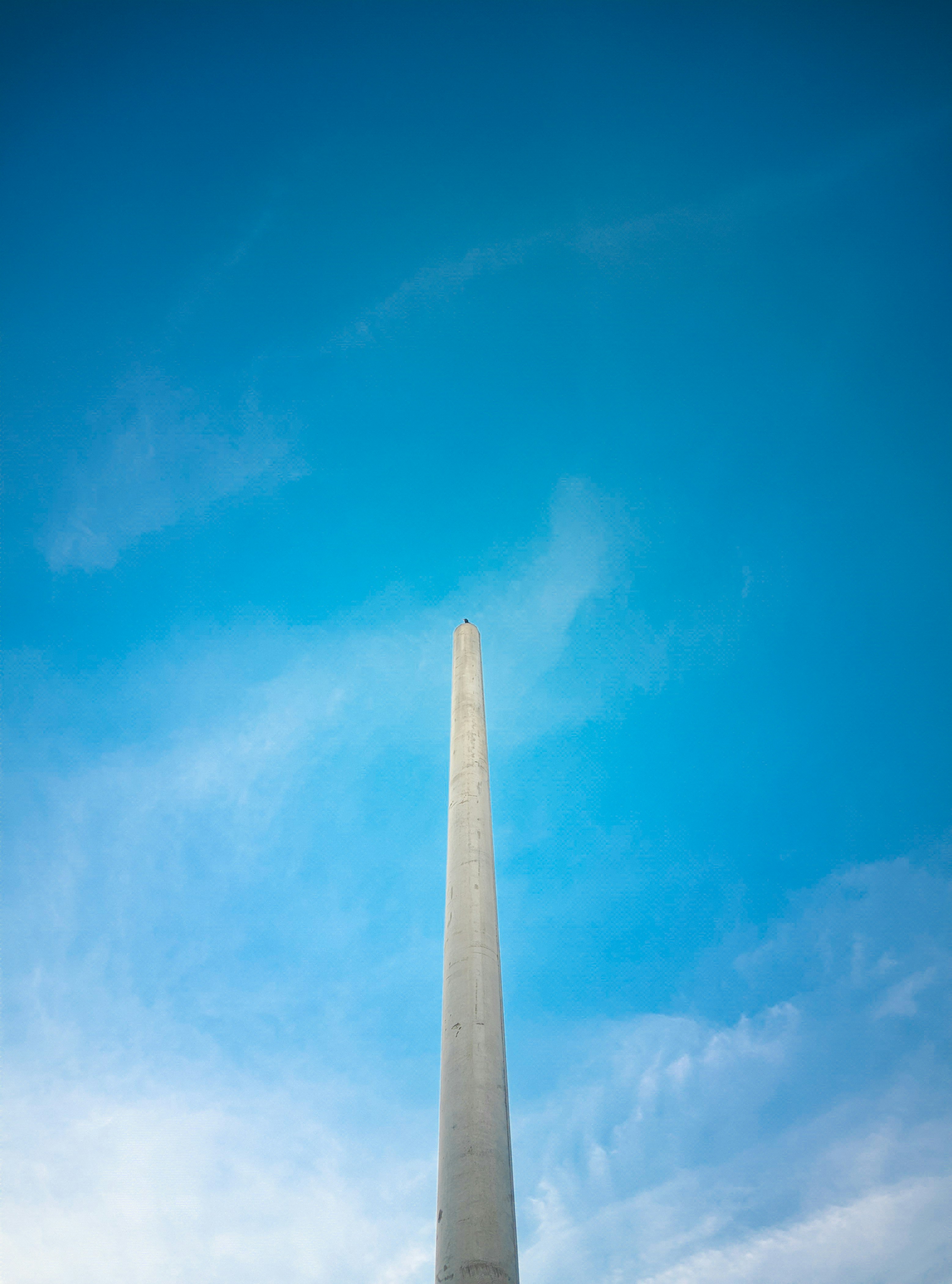 The washington monument in washington dc with a blue sky in the background