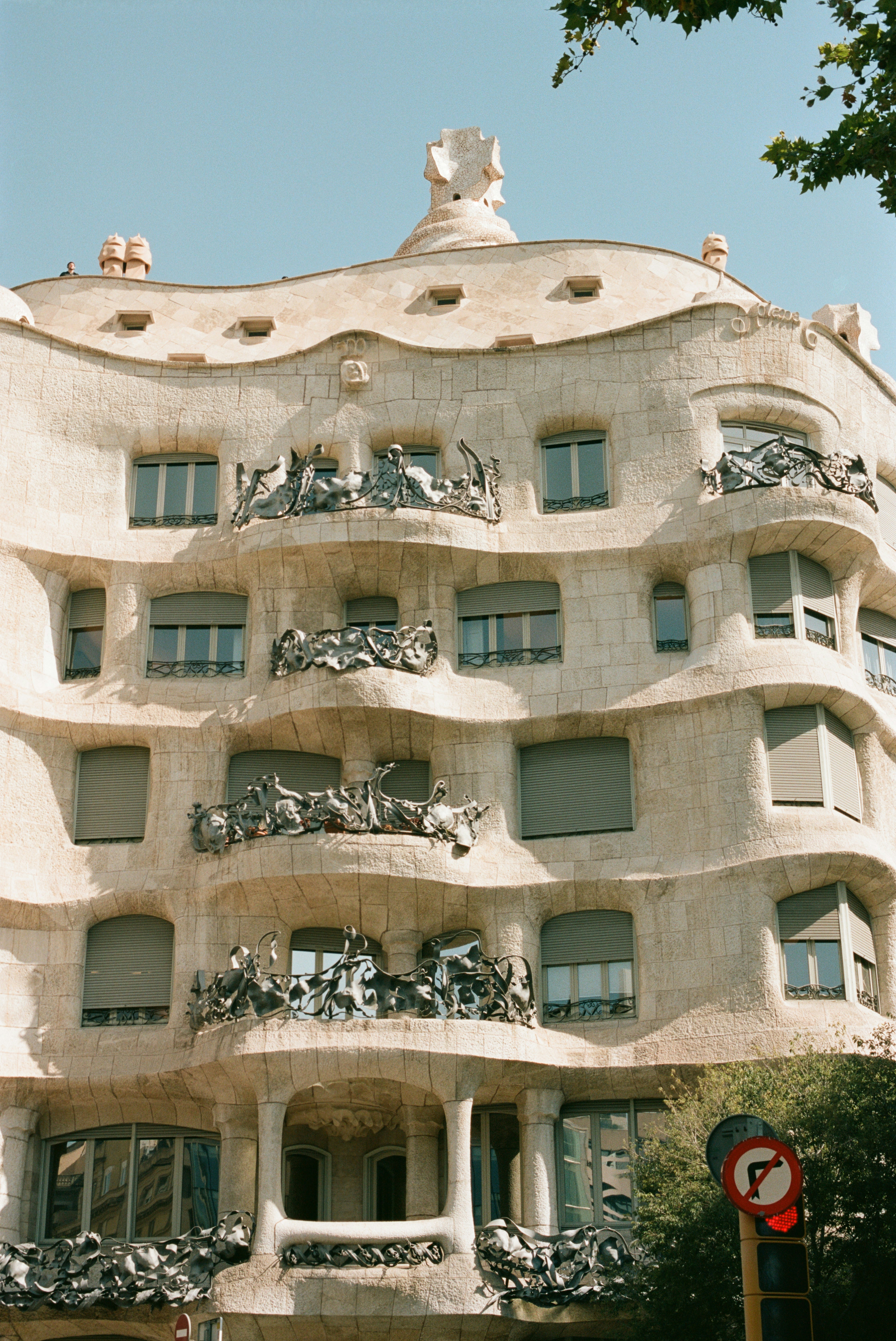 A tall building with many windows and balconies