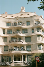 A tall building with many windows and balconies