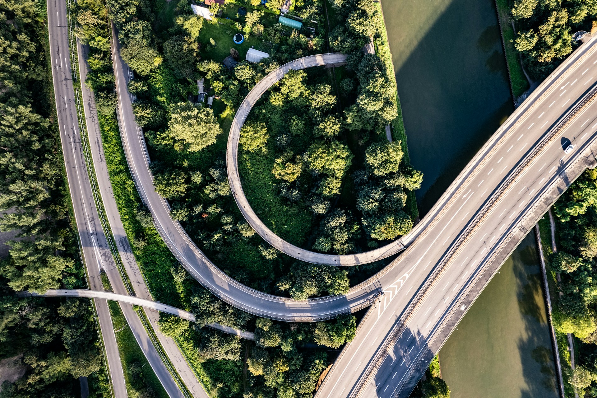 An aerial view of a highway intersection with multiple lanes