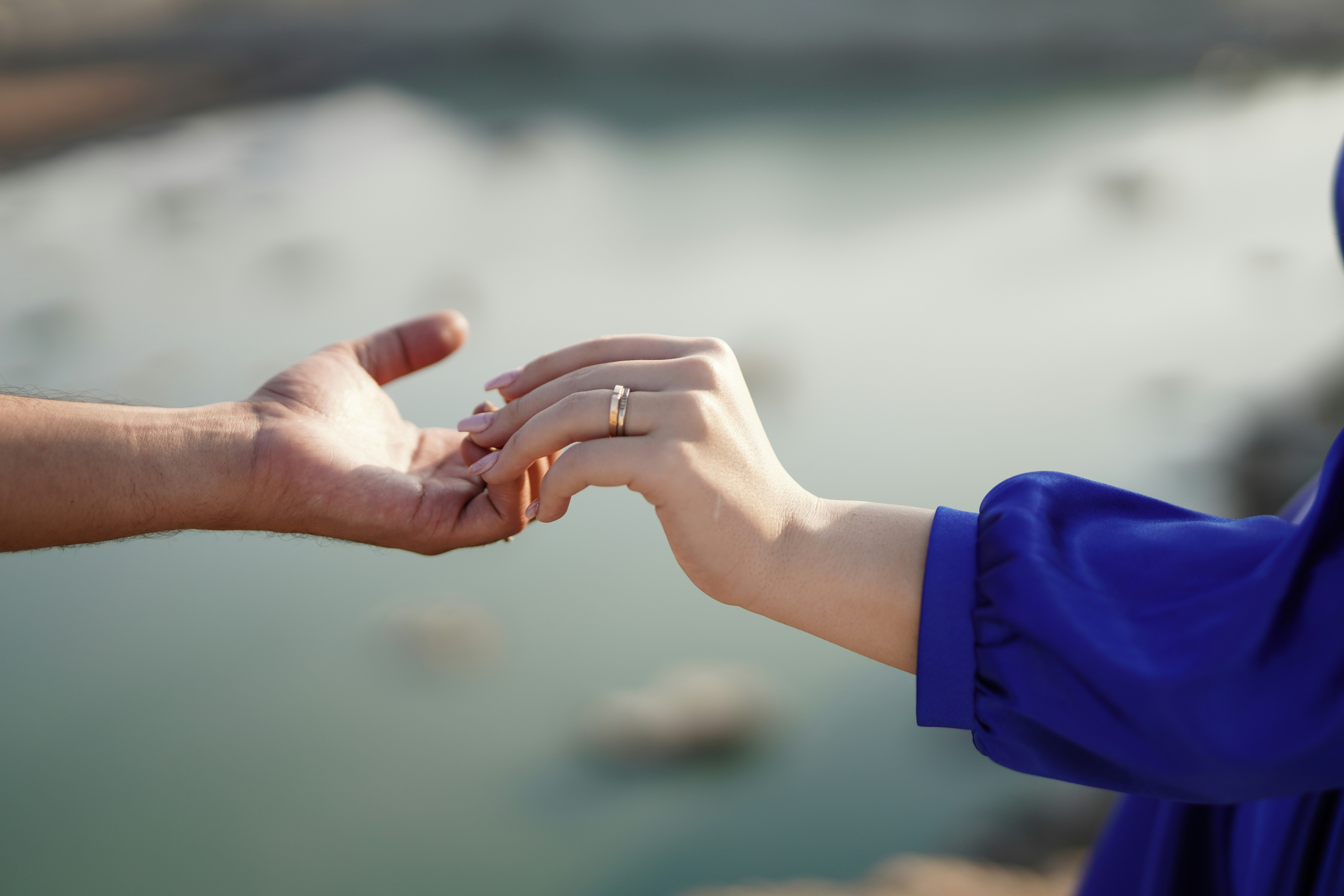 A couple of people that are holding hands