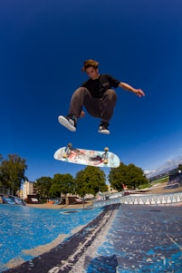 A man flying through the air while riding a skateboard