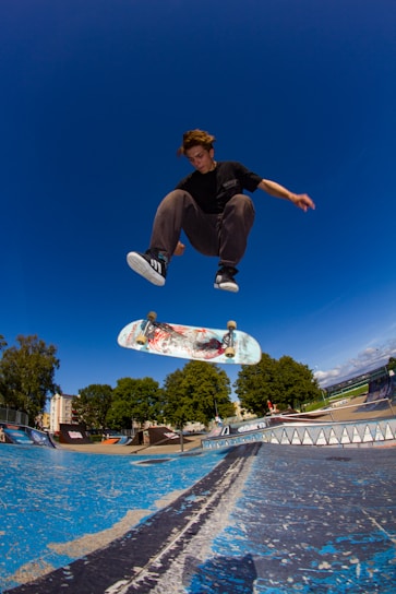A man flying through the air while riding a skateboard