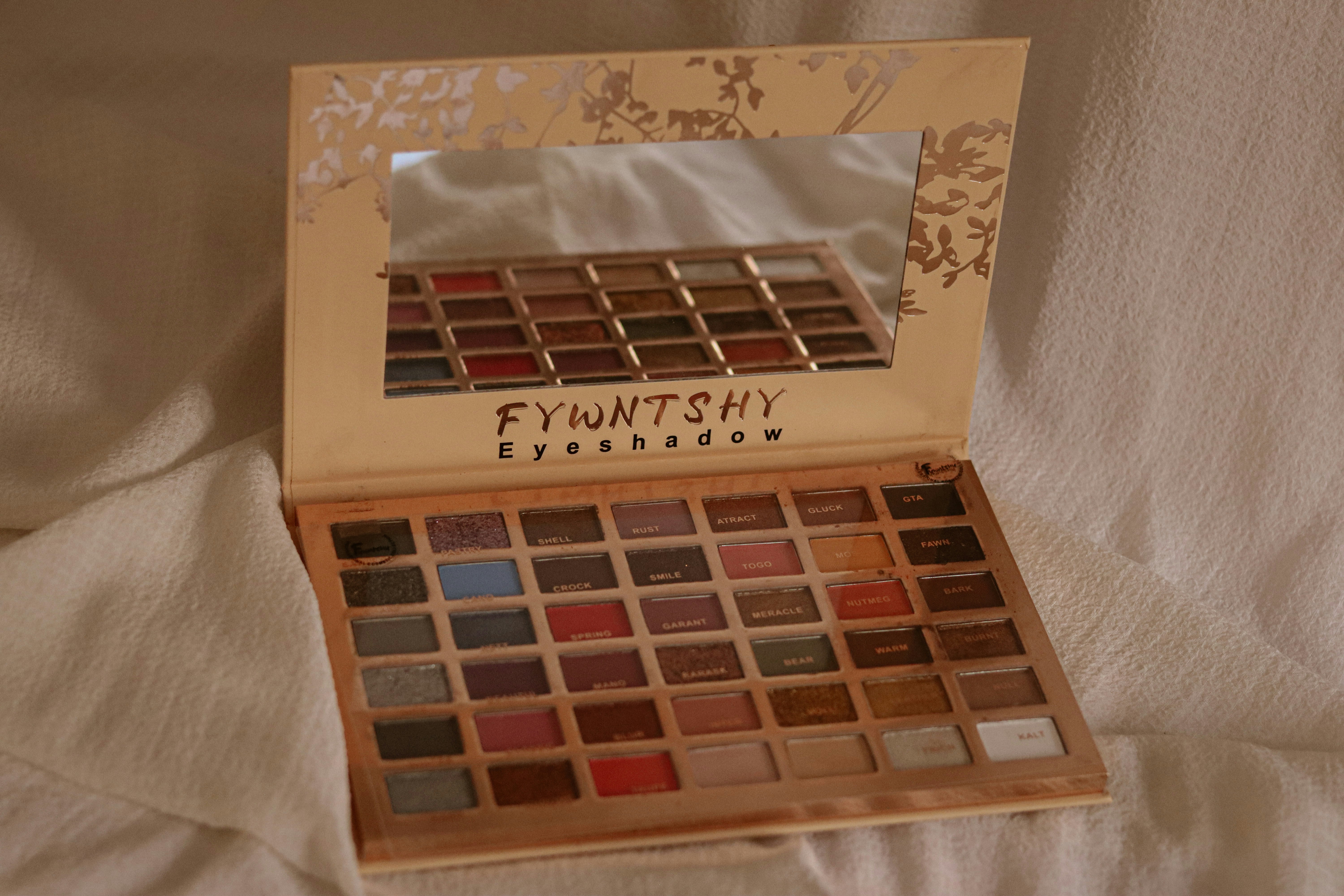 A box of eyeshades sitting on a bed