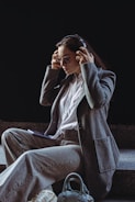 A woman sitting on steps talking on a cell phone