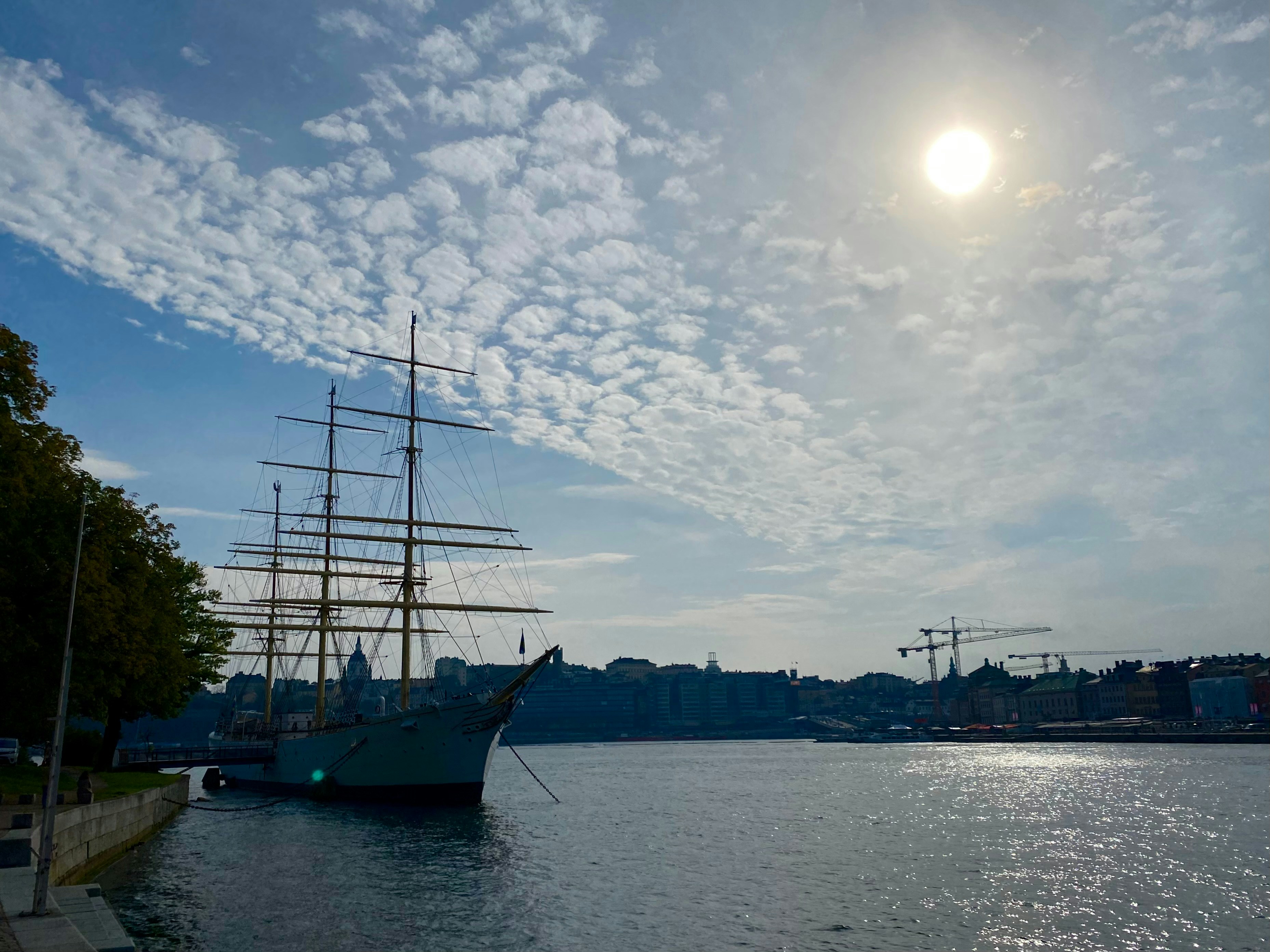 A large boat floating on top of a body of water