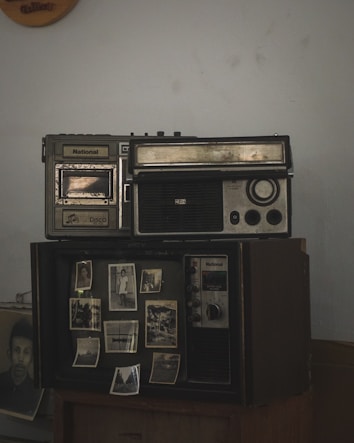 An old radio sitting on top of a table