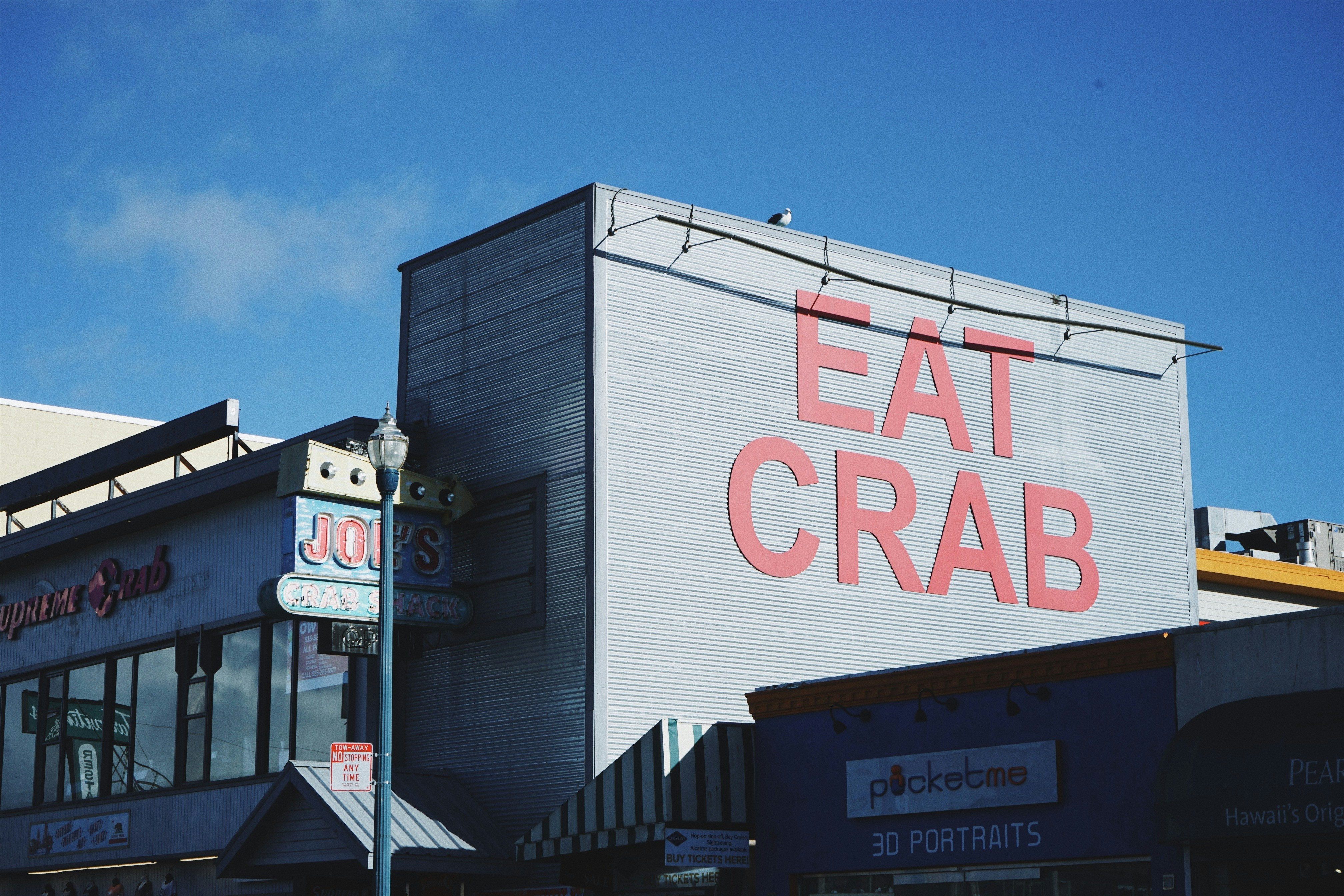 A building with a sign that says eat crab