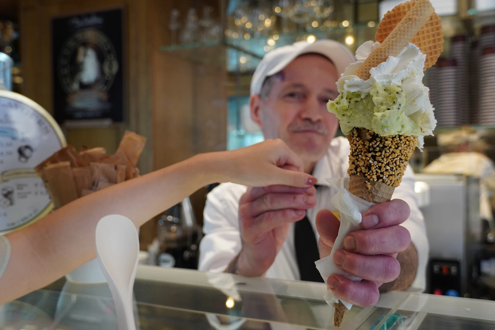 Gelato being served in an Italian gelateria