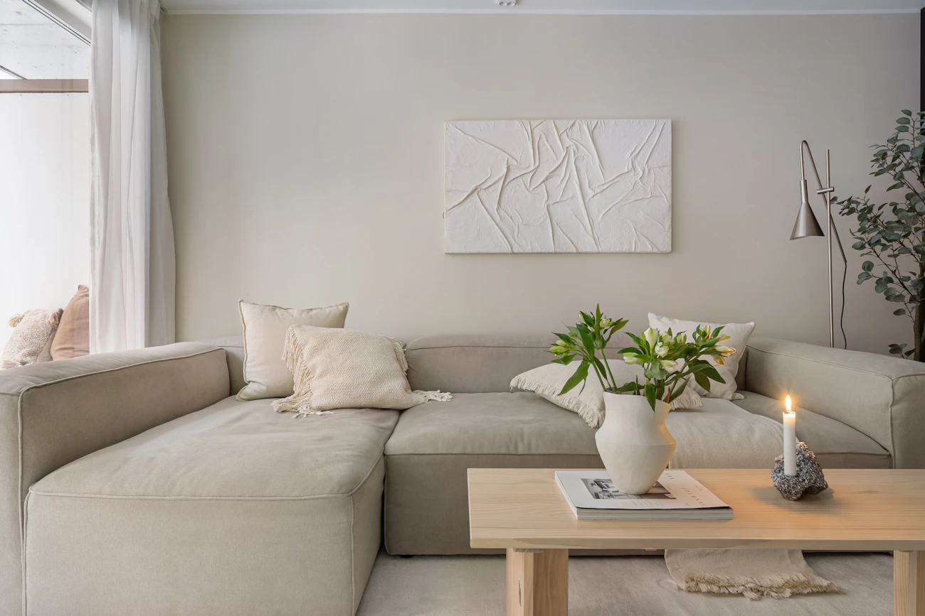 A quiet front room with a large window