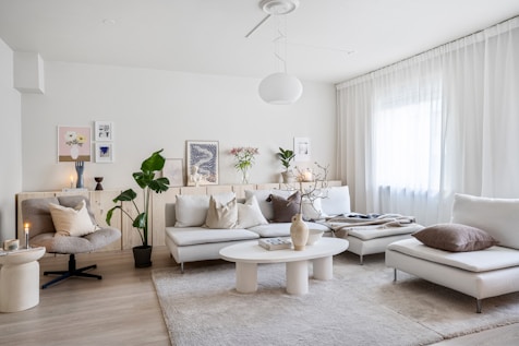 A living room filled with furniture and a large window