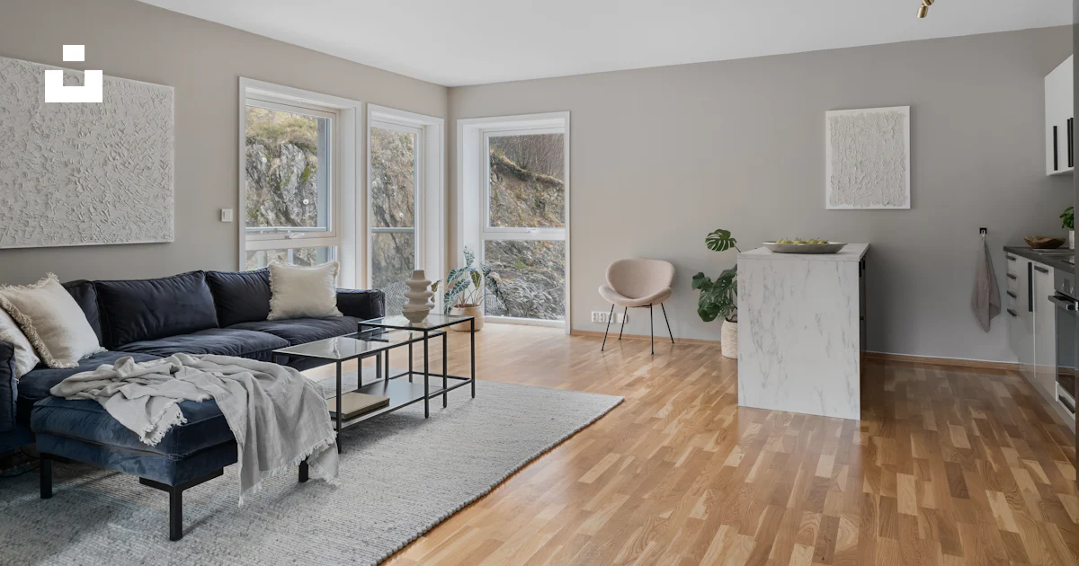 A living room filled with furniture and a hard wood floor photo – Free ...