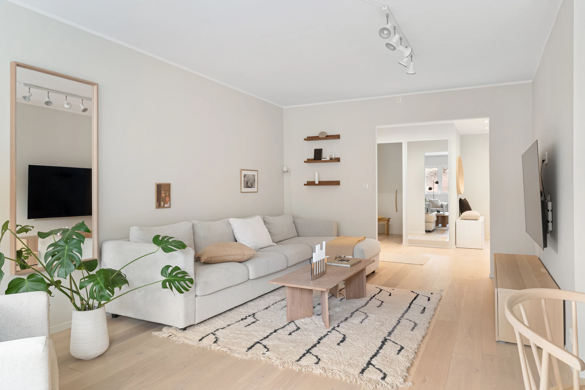 A living room filled with furniture and a flat screen TV