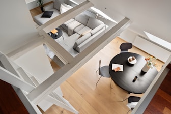 An aerial view of a living room and dining room